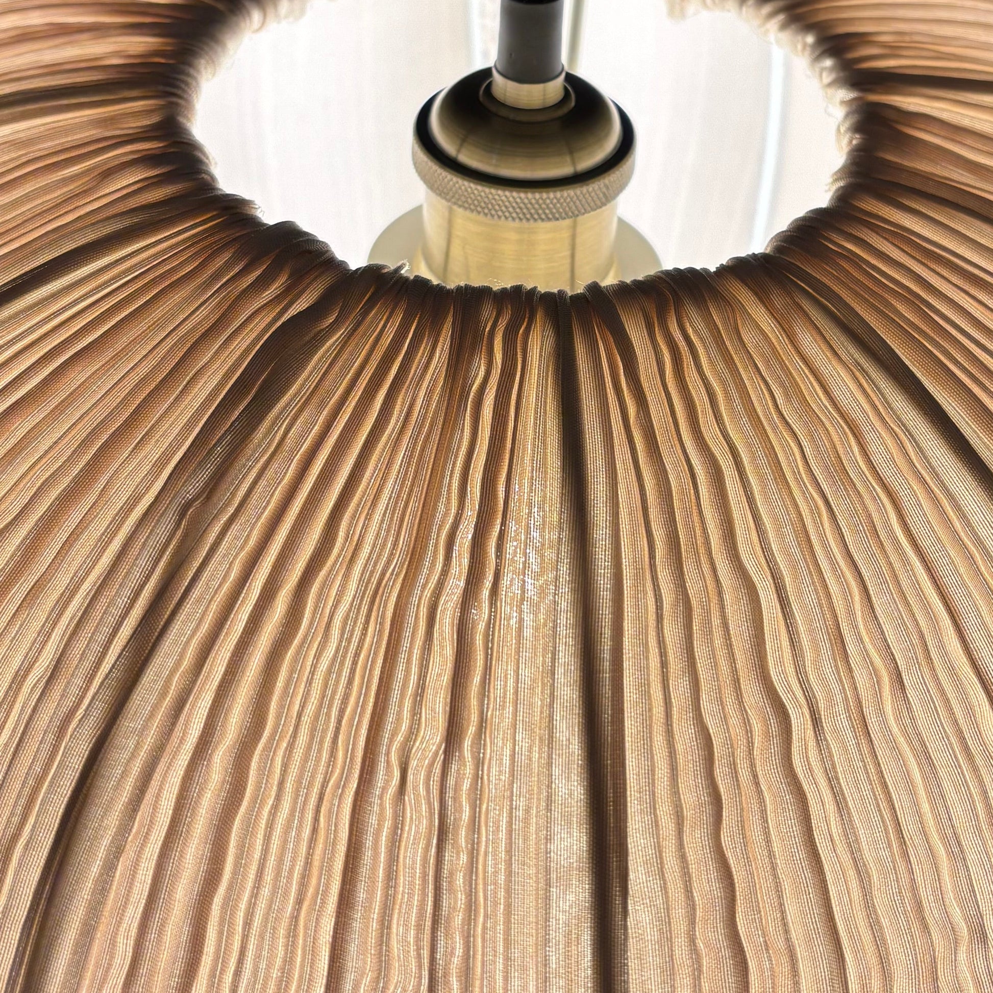 Close-up of a wooden pendant lamp with a dark background