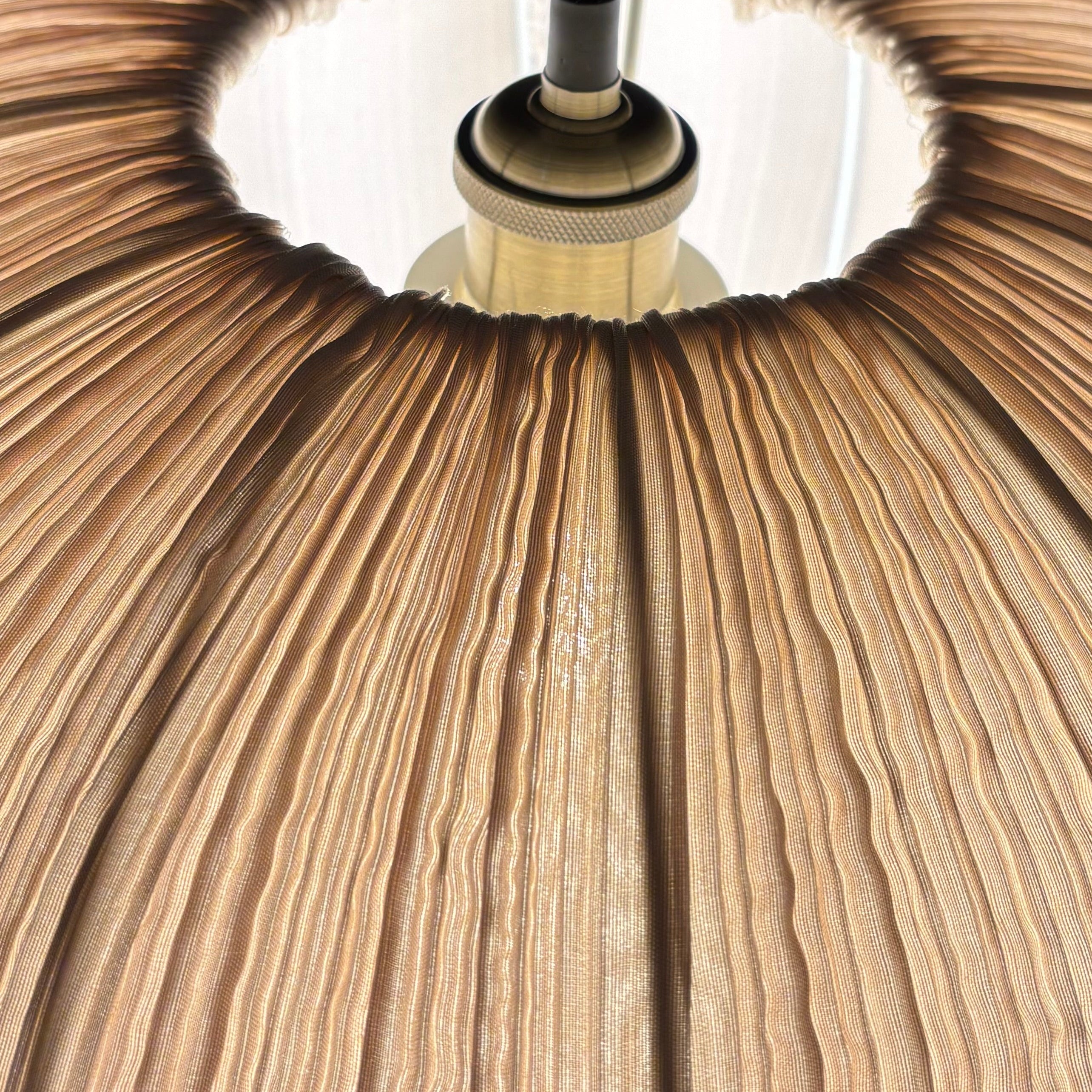 Close-up of a wooden pendant lamp with a dark background