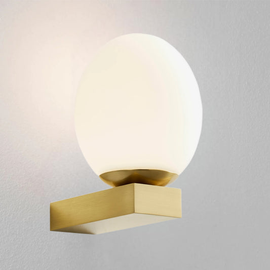 Our Jasper satin brass wall light with white opal glass diffuser adds a touch of opulence and luxury to the walls of your home. The modern light fitting would look perfect installed next to a mirror, on corridors or hallways, bedside and living rooms, this light also has IP44 protection making it suitable for all bathrooms. 