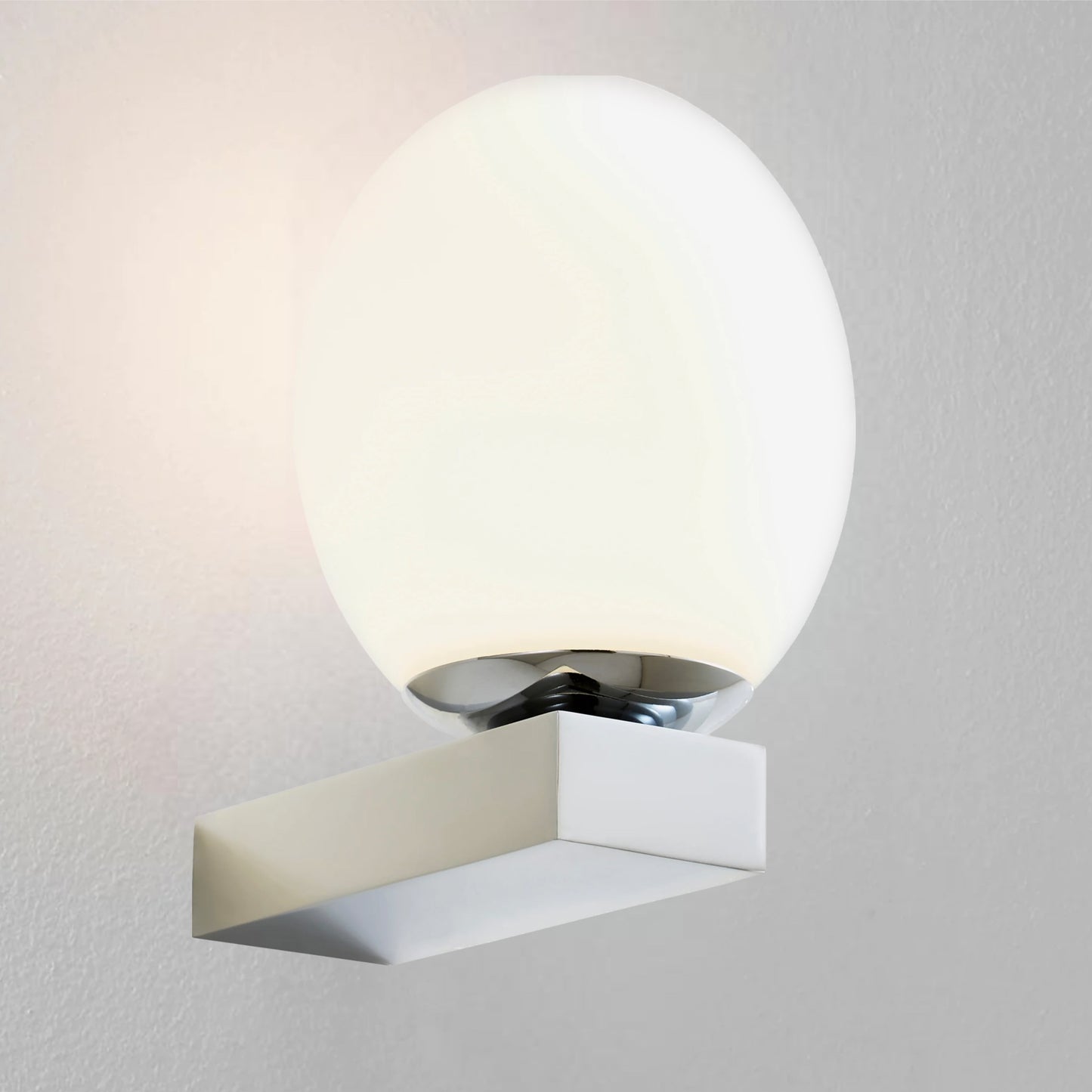 Our Louis chrome wall light with white opal glass diffuser adds a touch of opulence and luxury to the walls of your home. The modern light fitting would look perfect installed next to a mirror, on corridors or hallways, bedside and living rooms, this light also has IP44 protection making it suitable for all bathrooms. 
