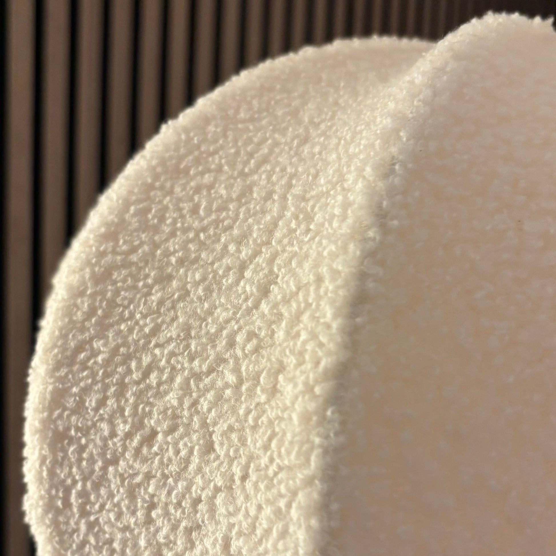 Close-up of a textured white object against a dark background