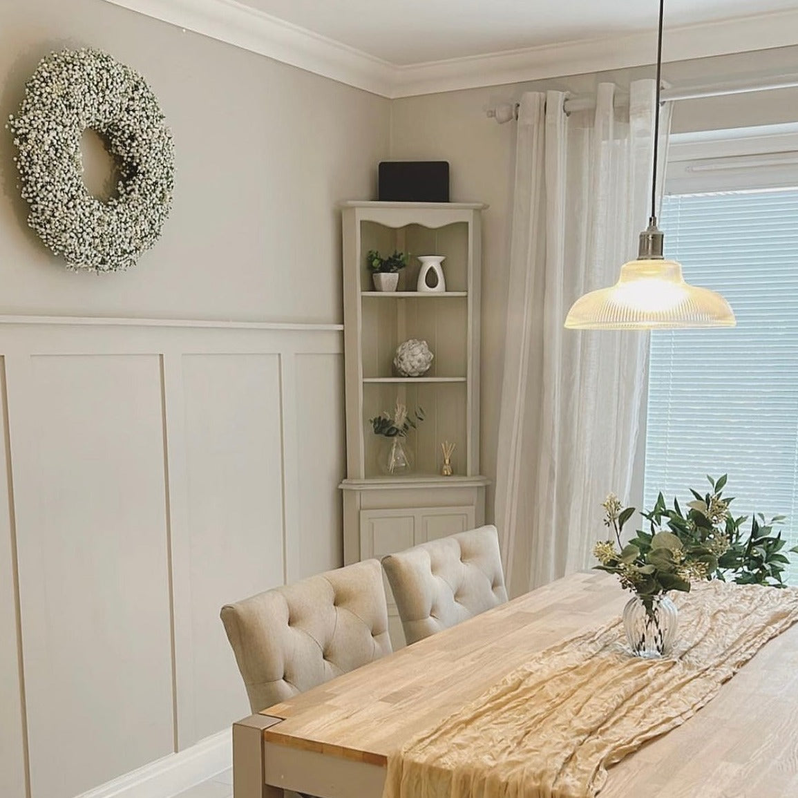 Dining room with a table, chairs, and decorative elements.