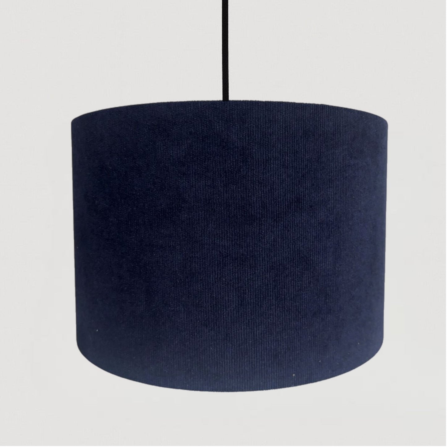 Navy blue lampshade on a white background