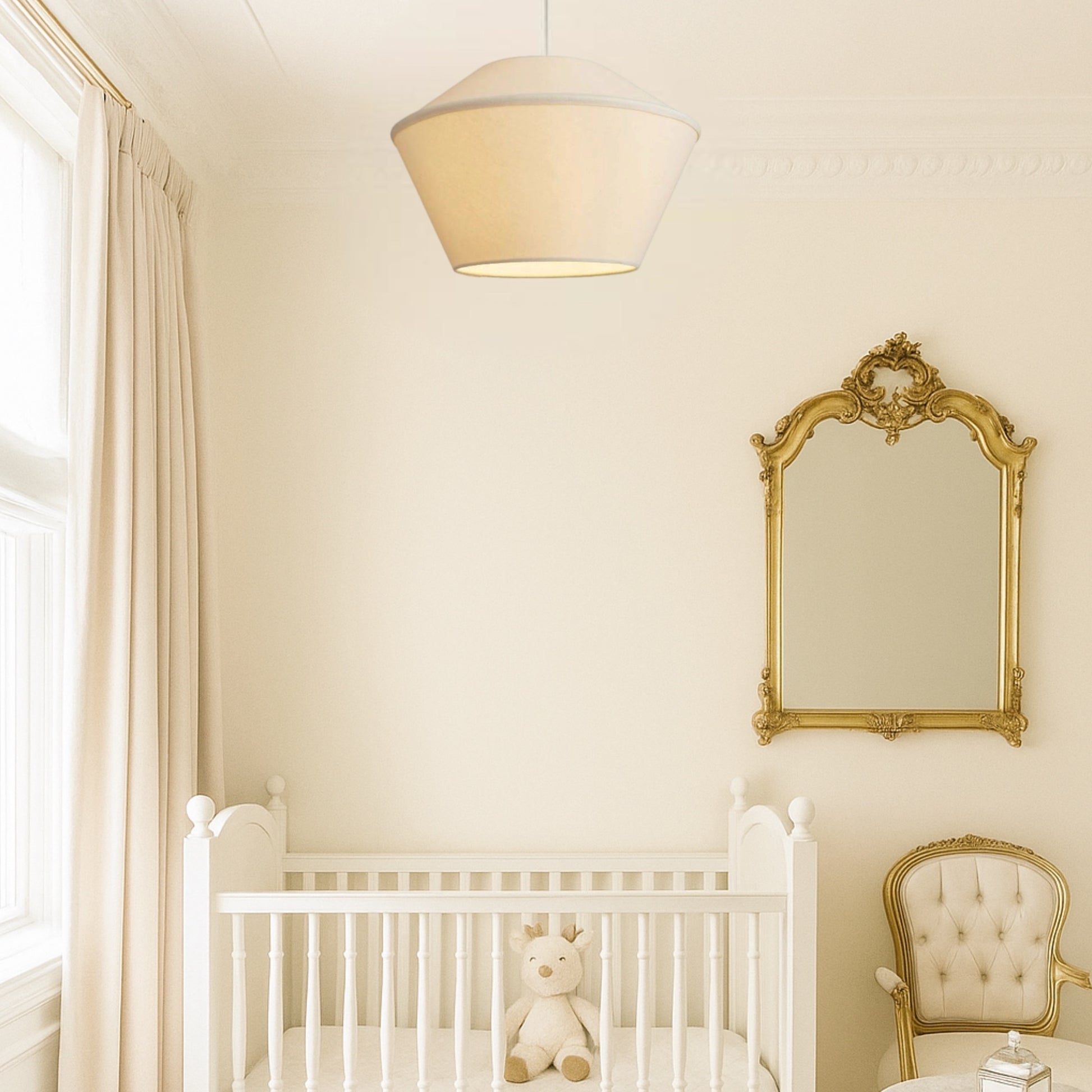 Nursery room with white crib, decorative mirror, and chair.
