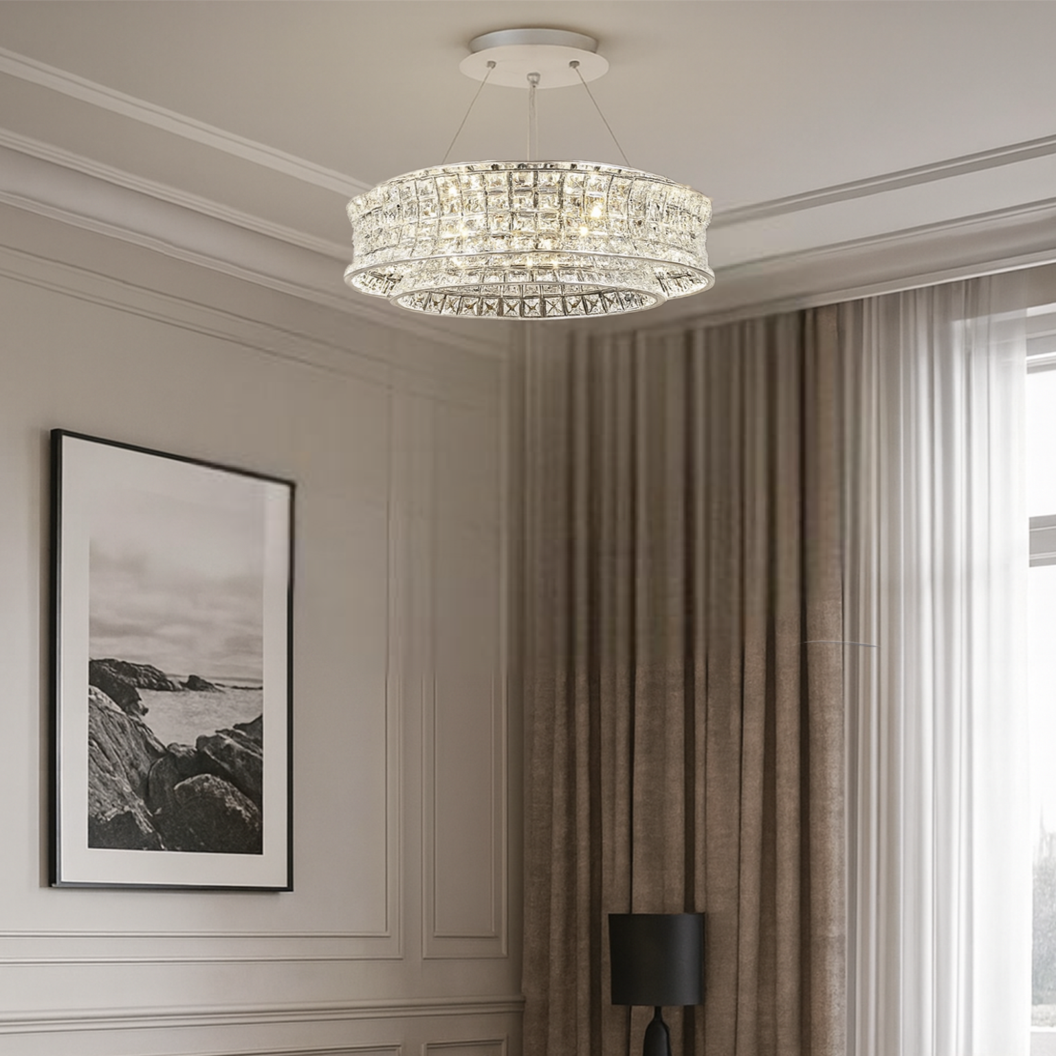 Modern living room with a chandelier, sofa, and armchair.