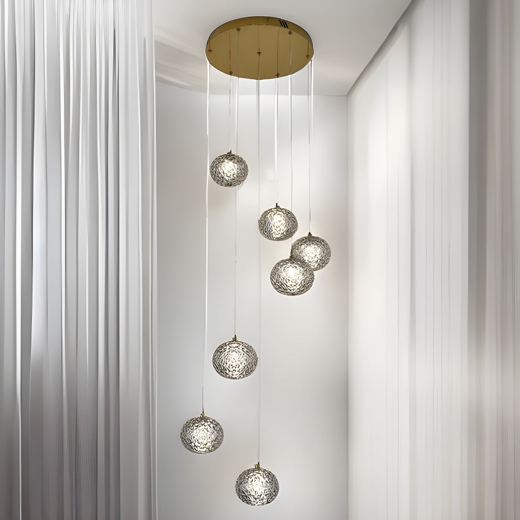 Our striking 6 Ball LED pendant light in gold with height adjustable smoked acrylic globes is the perfect way to make a statement with your interiors. It is inspired by elements of the night sky, comprising of a delicately crafted smoked acrylic crystal globes in round spherical shape and perfectly finished in low energy built in LED lights.