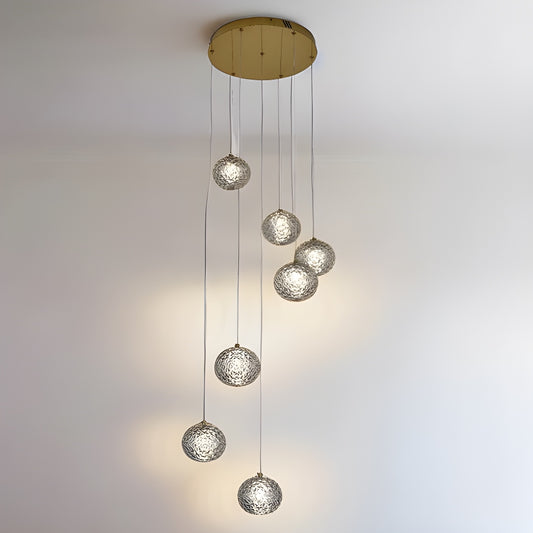 Our striking 6 Ball LED pendant light in gold with height adjustable smoked acrylic globes is the perfect way to make a statement with your interiors. It is inspired by elements of the night sky, comprising of a delicately crafted smoked acrylic crystal globes in round spherical shape and perfectly finished in low energy built in LED lights.