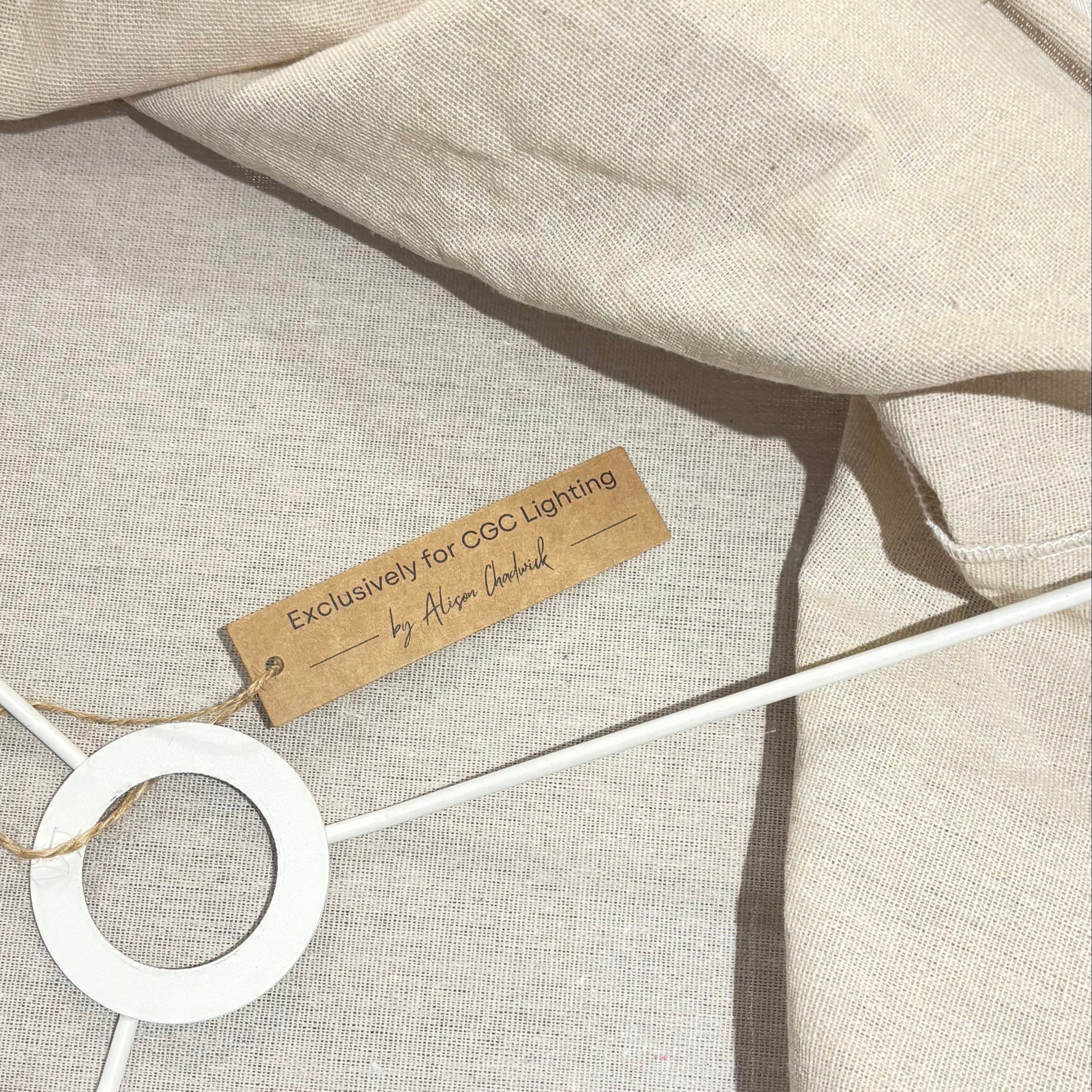 Close-up of a beige fabric product with a label on a white background