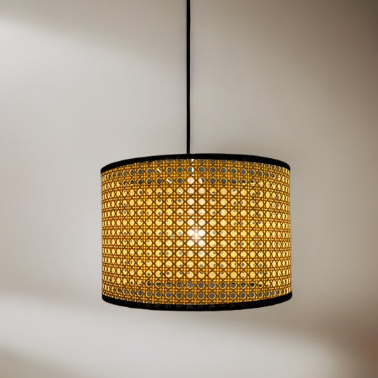 Traditional and sleek drum shaped easy fit pendant light shade with woven rattan frame. Simply attaches to your existing pendant wire cable. Finished in a unique light brown material in a woven style and complete with a black cotton trim giving this product a very natural and minimalist finish. This fantastic shade can double up as either a ceiling pendant light shade or table lampshade. 