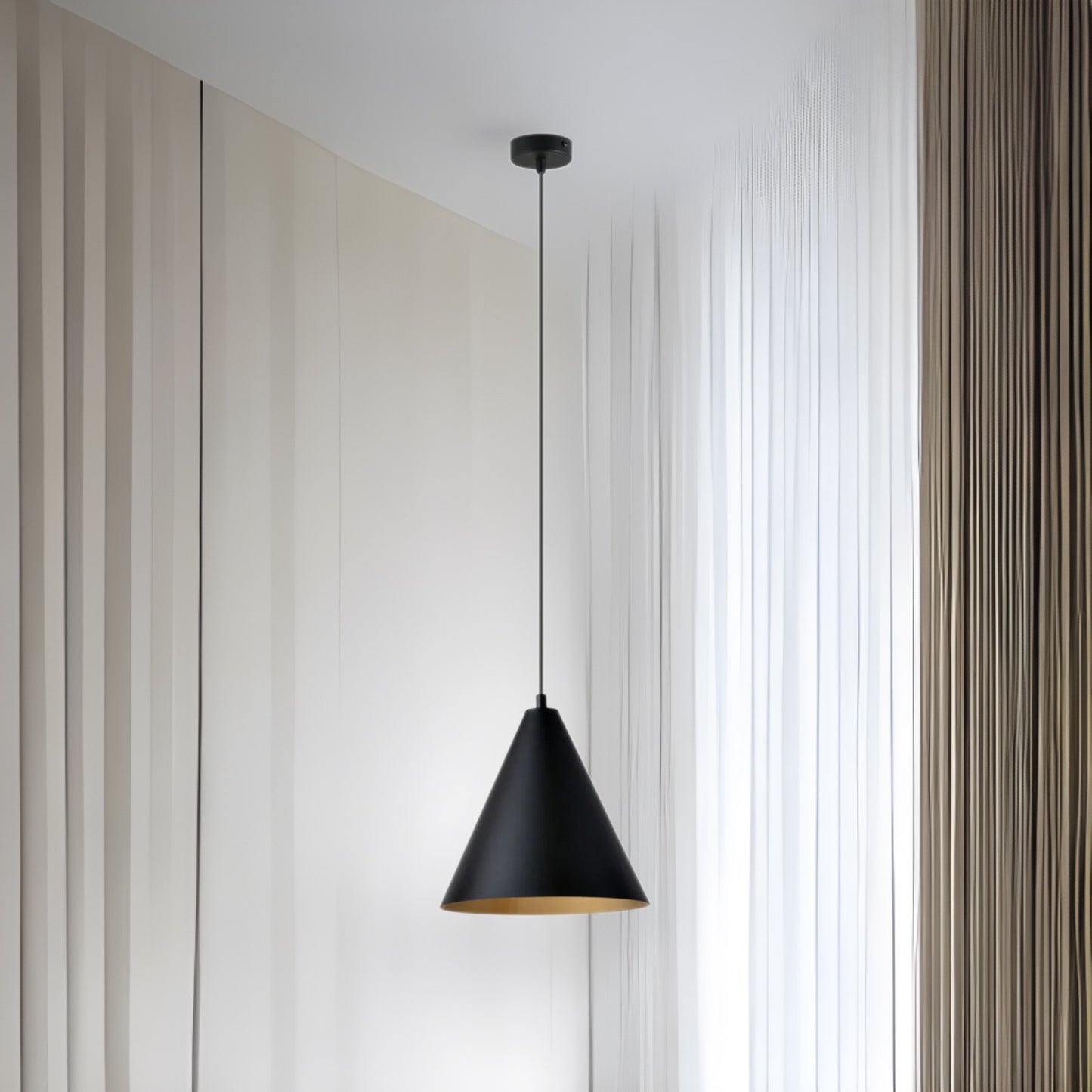 Introduce a note of industrial style into your interior with a hanging lamp from the REBEL series. The solid steel structure harmonizes with the black conical lampshade, whose golden interior adds unique character and the warmth of the diffused light. This combination of colors and materials makes the lamp fit perfectly into modern, austere spaces, adding expressiveness to them.