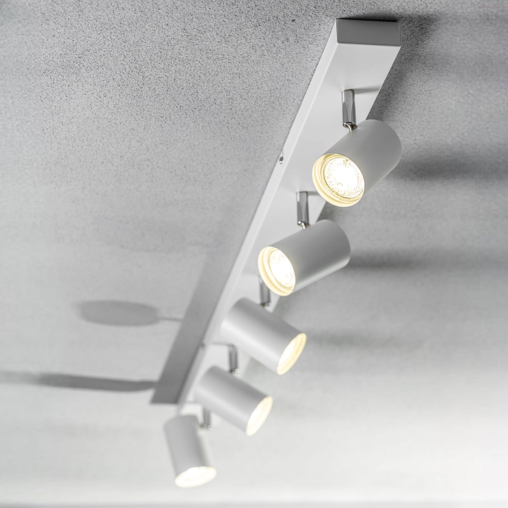 Add an industrial style to your home with the VENETO  spotlight light finished in white. The lamp is also ideal for task lighting due to the adjustable heads providing a focused beam. The simplistic design of this light fitting makes it suitable for all interior styles.