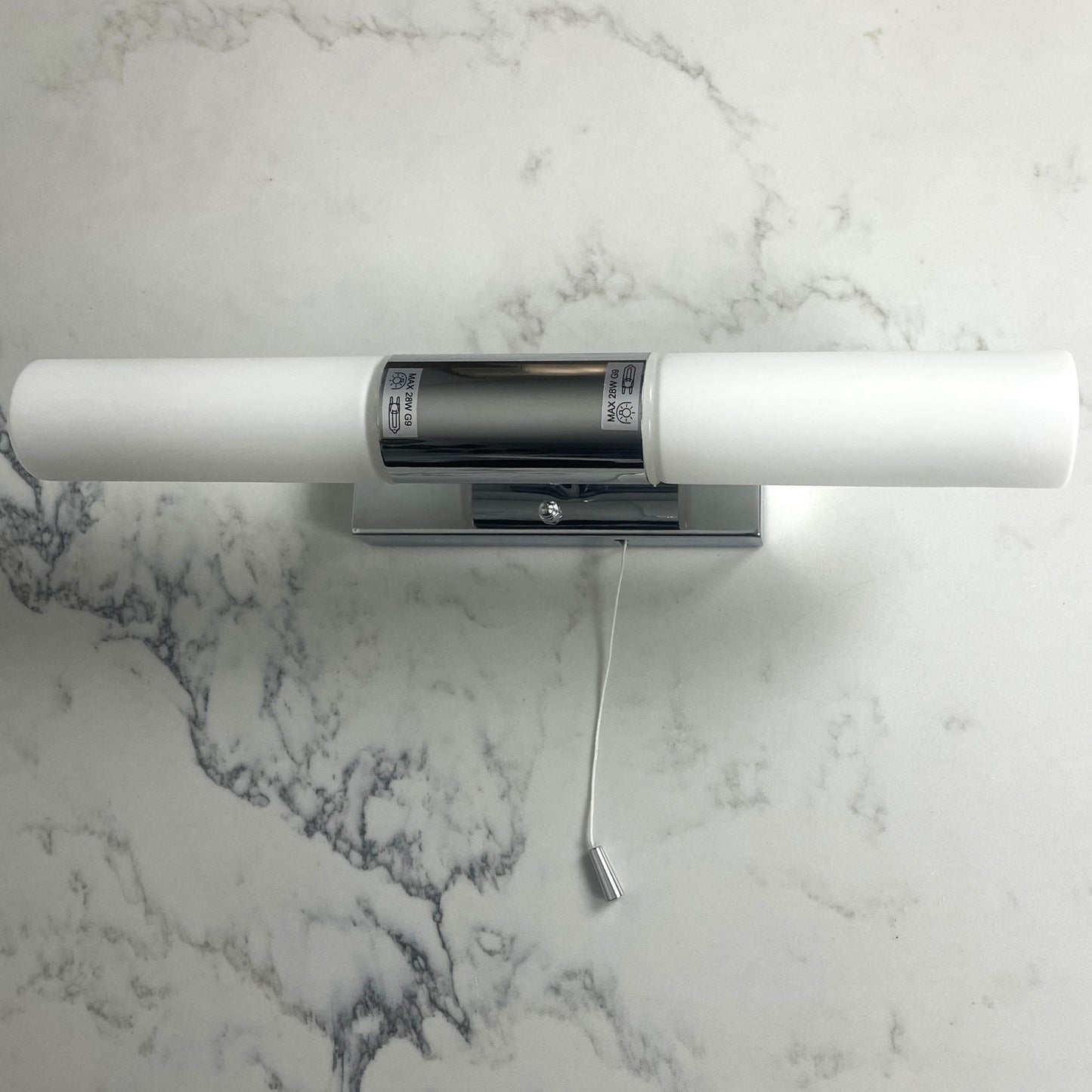 A wall light that is incredibly sleek and modern and would look great in any bathroom. The bathroom will look great with the elegant chrome finish. A soft, gentle light is produced by the two opal white lamps. This wall light has an IP value of IP44 so that you can place it in damp spaces such as the bathroom.