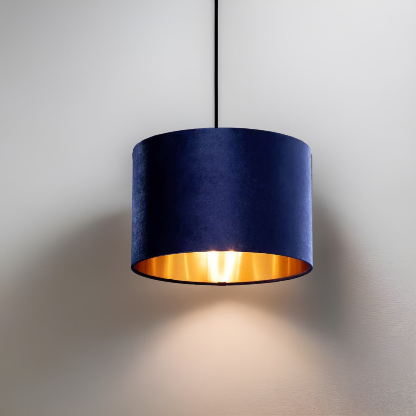 Our Nila velvet shade is sophisticated in appearance and we have designed the shade to  suit a range of interiors. Easy to fit, it’s crafted from high-quality velvet on the outer and has a reflective gold metallic inner. It's made to fit both a ceiling light or lamp base.