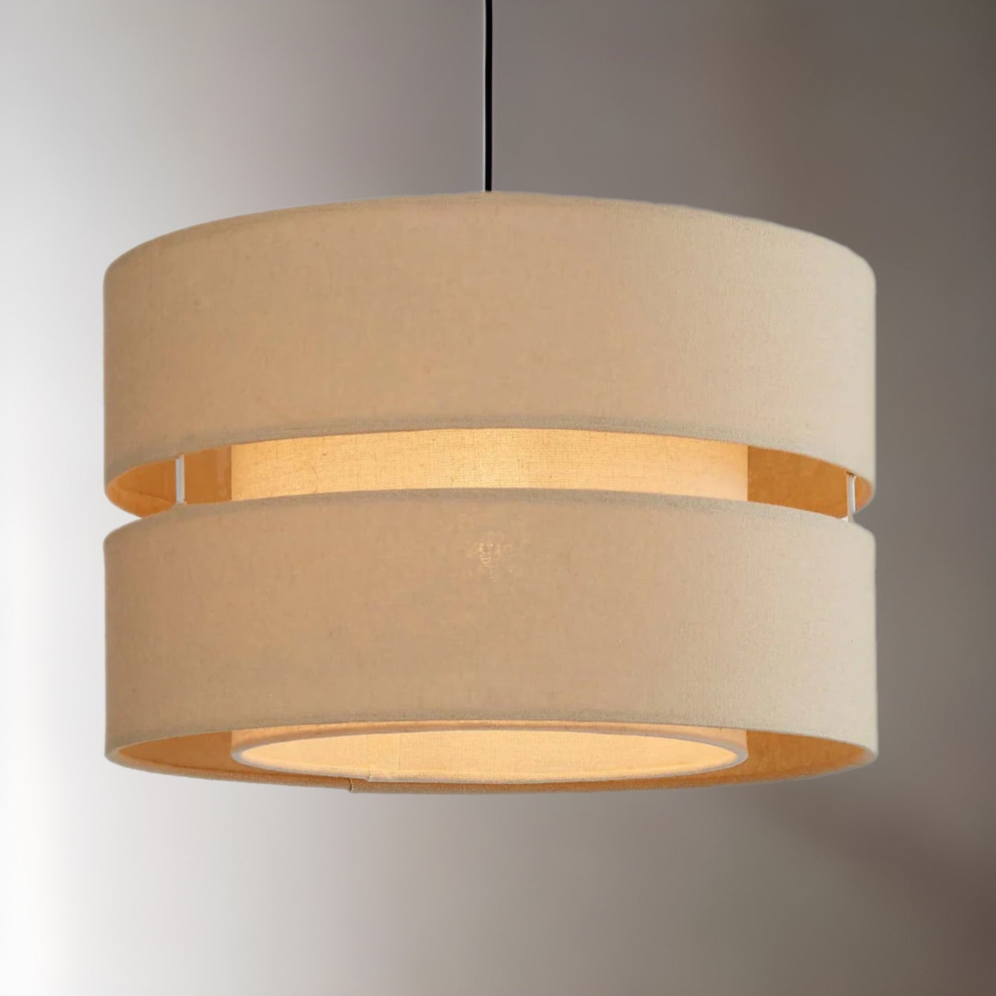 Our Gayle easy fit two tiered luxury fabric double layered shade is contemporary in its appearance and we have designed the shade to suit a range of interiors. Easy to fit simply attached to an existing pendant flitting.  It is crafted from high quality fabric material in two layers and complimented with a matching inner which looks beautiful when light shines through. The shade has been made to fit both a ceiling light or lamp base.