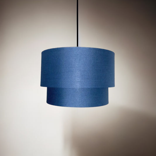 Our Kimber easy fit two tiered luxury fabric double layered shade is contemporary in its appearance and we have designed the shade to suit a range of interiors. Easy to fit simply attached to an existing pendant flitting.  It is crafted from high quality fabric material in two layers and complimented with a white inner.