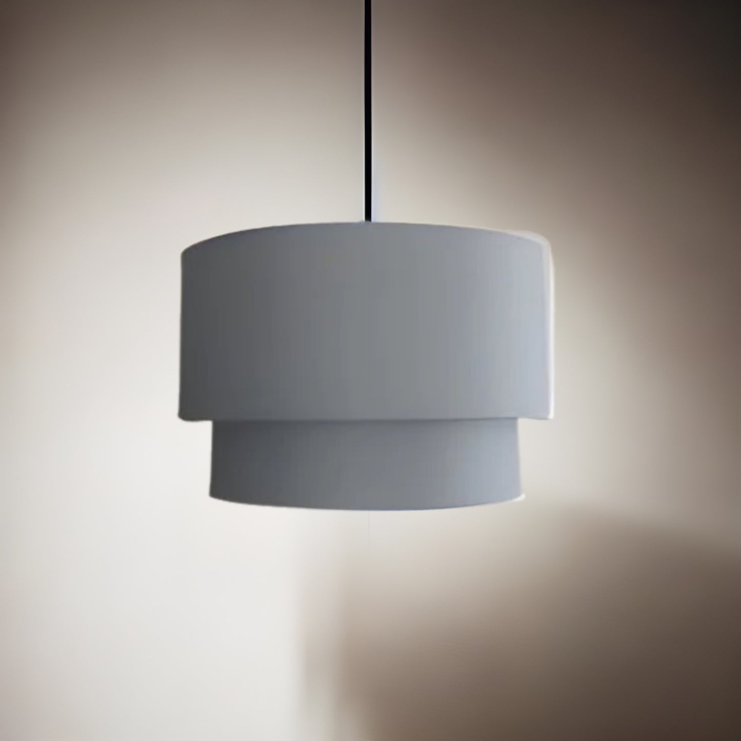 Our Kimber easy fit two tiered luxury fabric double layered shade is contemporary in its appearance and we have designed the shade to suit a range of interiors. Easy to fit simply attached to an existing pendant flitting.  It is crafted from high quality fabric material in two layers and complimented with a white inner.