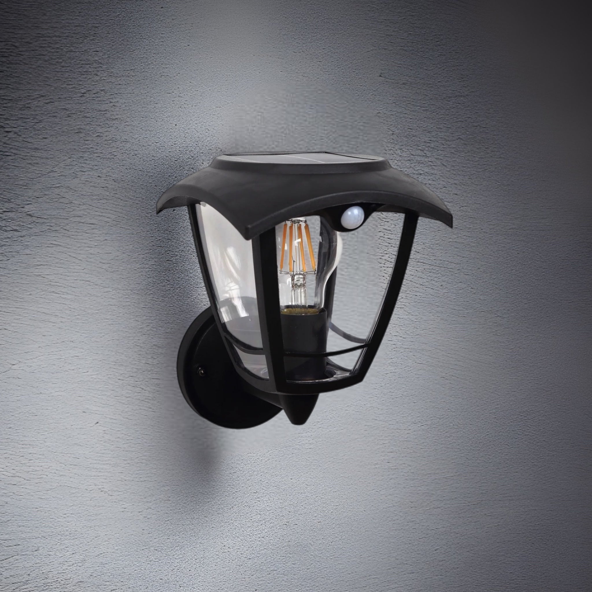 Create an aesthetically pleasing lighting system around your home with our Lara solar lantern light for your walls. This product is featured as an elegant and traditional lantern wall light design, constructed from black polycarbonate and fitted with clear polycarbonate diffusers. The Lara wall light comes complete with an integrated filament warm white LED bulb and integrated PIR motion sensor