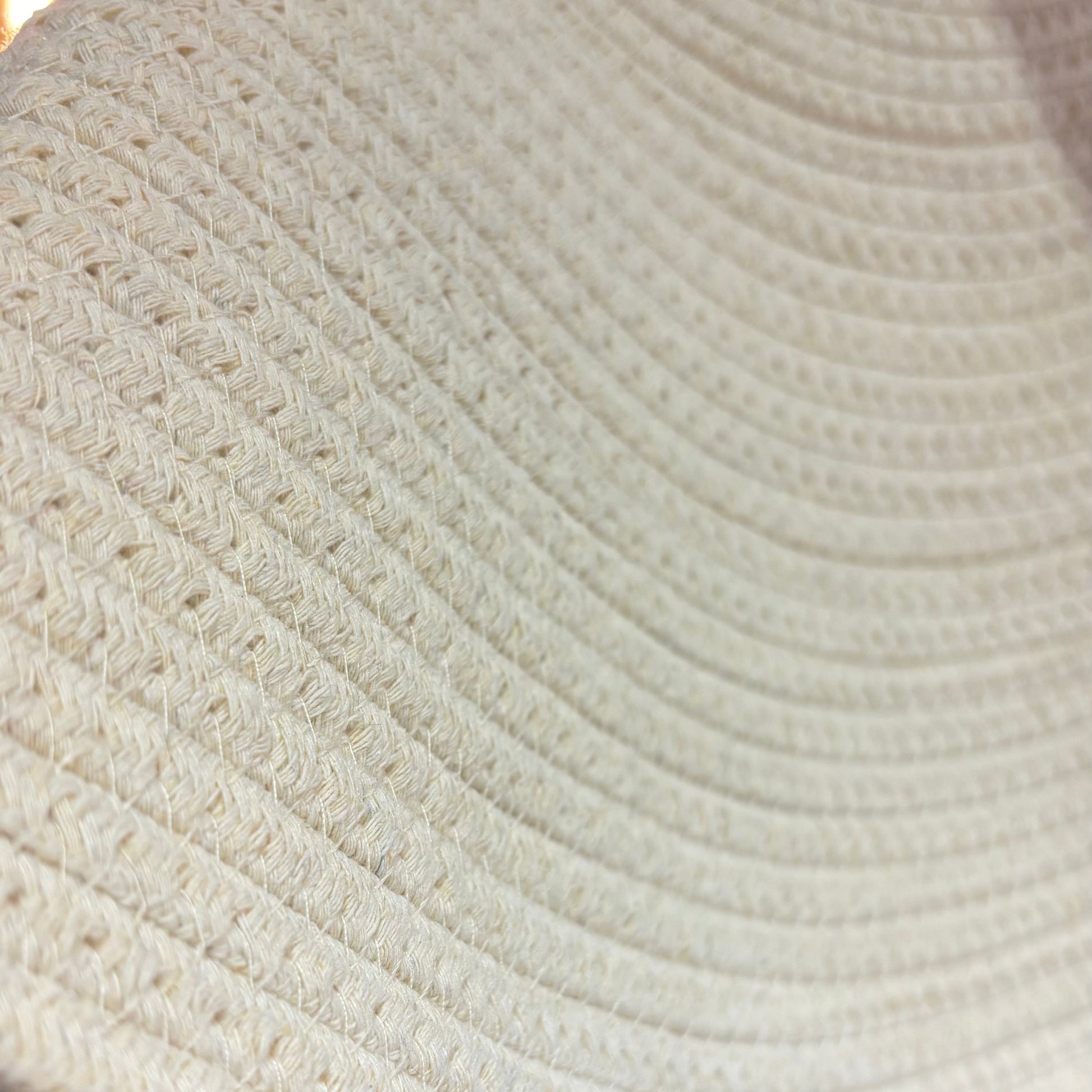 Close-up of a textured beige fabric with a blurred background