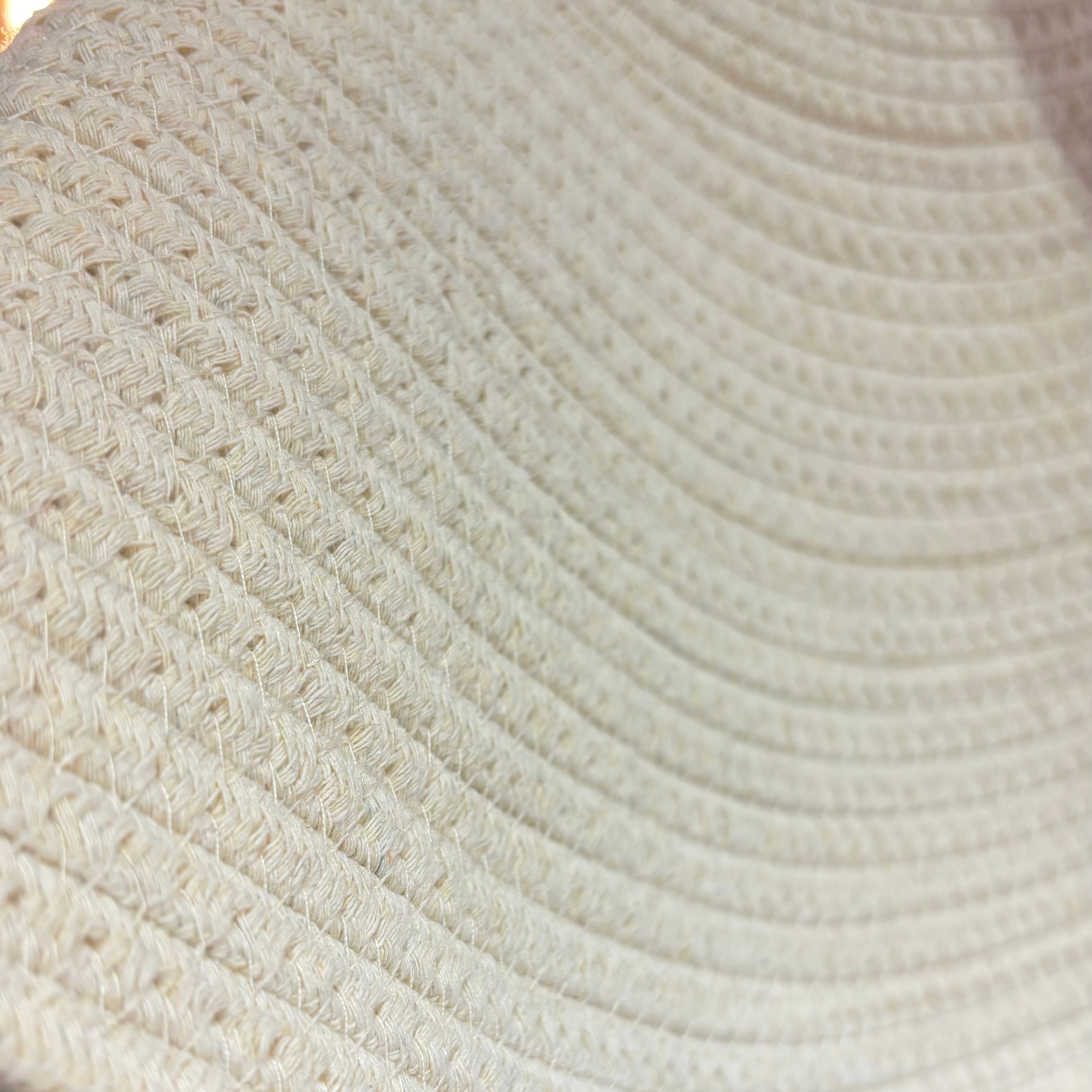 Close-up of a textured beige fabric surface