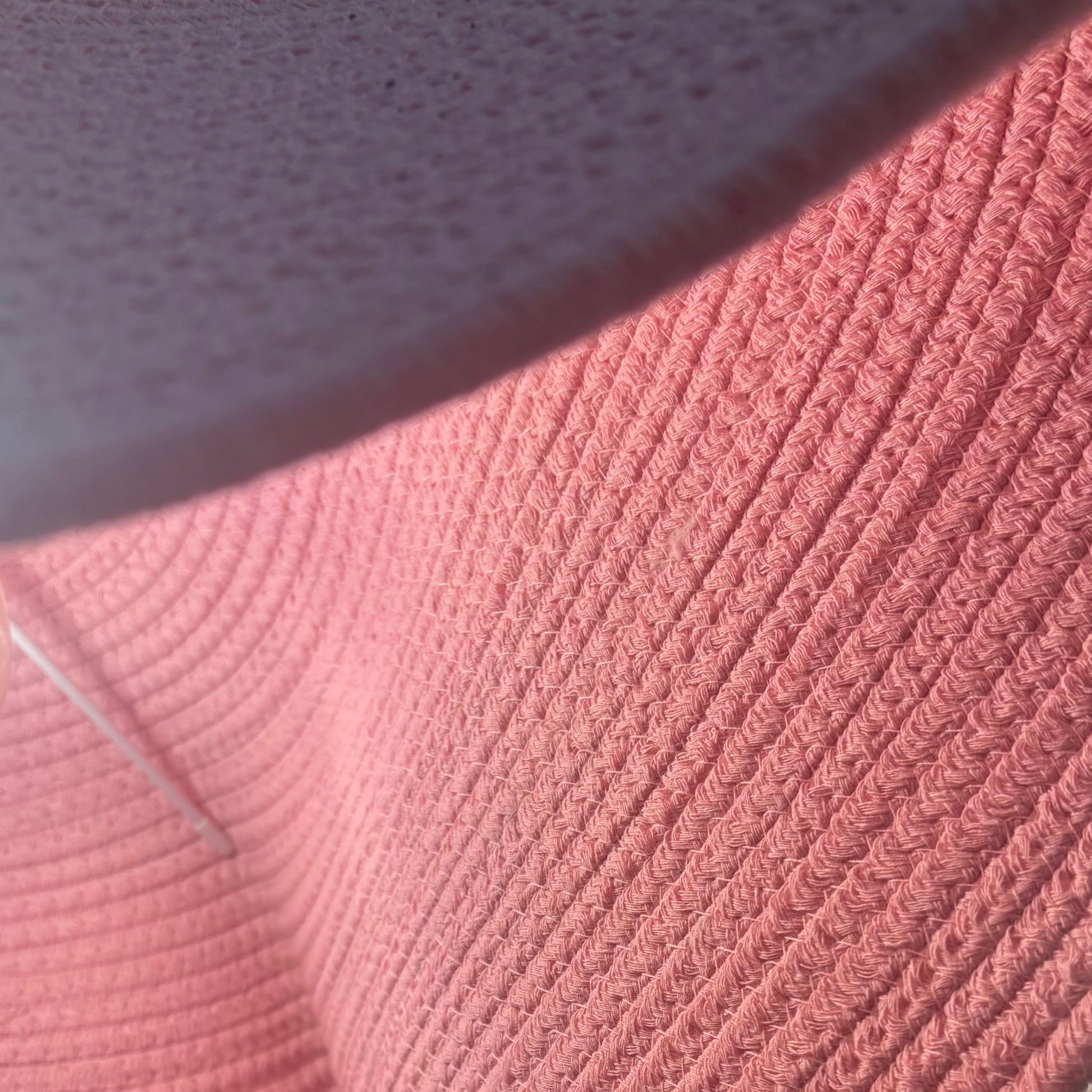 Close-up of a textured pink fabric surface