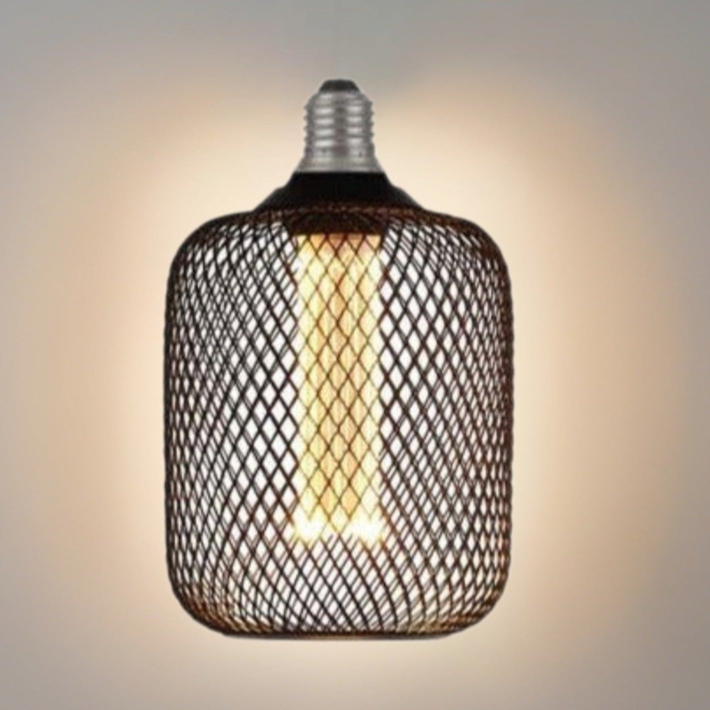 Our decorative black mesh E27 LED drum bulb provides a unique aesthetic, blending seamlessly into many decors. Made from black wire mesh in drum cross hatch pattern giving this bulb a real industrial feel. This energy-saving bulb is perfect for exposed lighting designs fits any standard E27 lamp holder.
