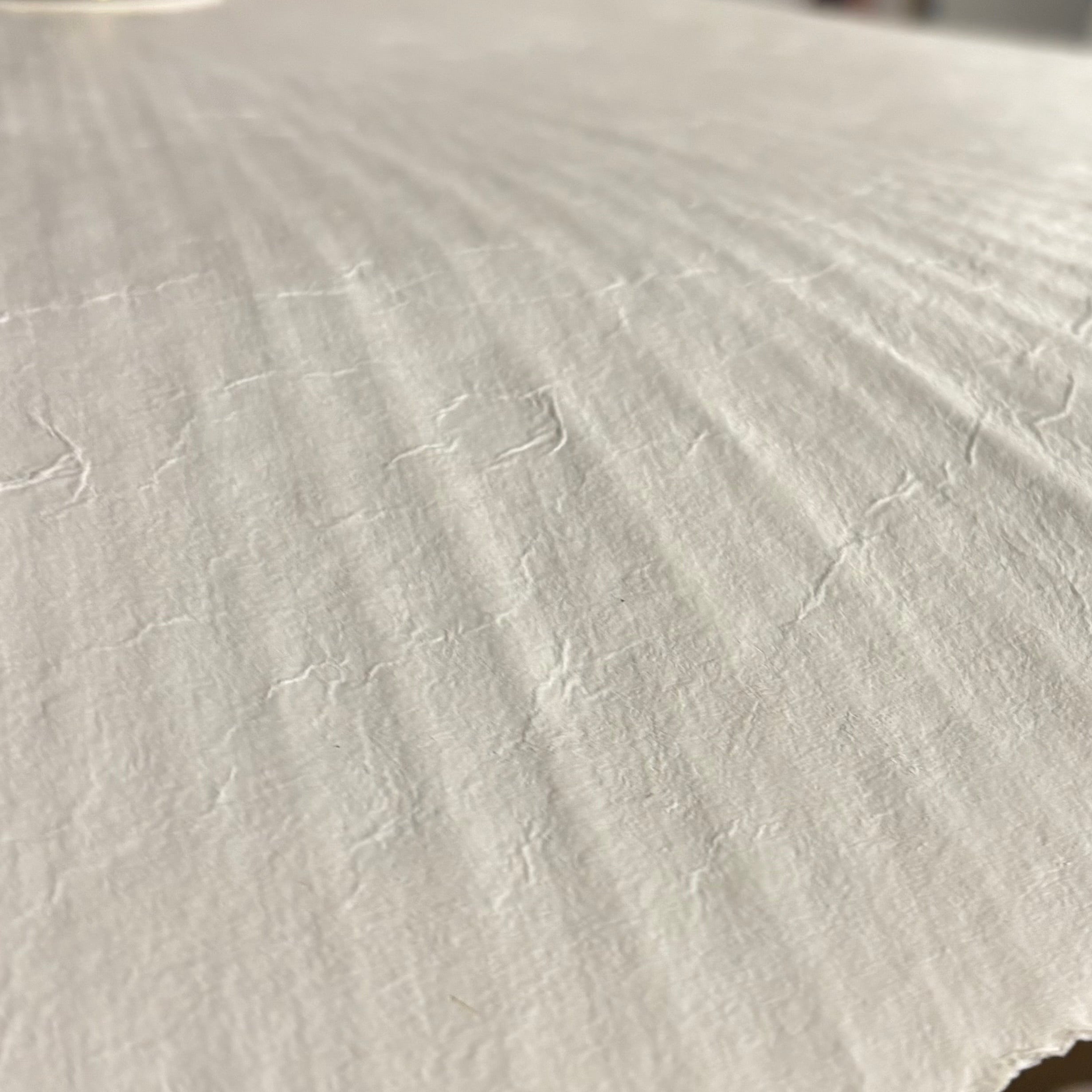 Close-up of textured white paper