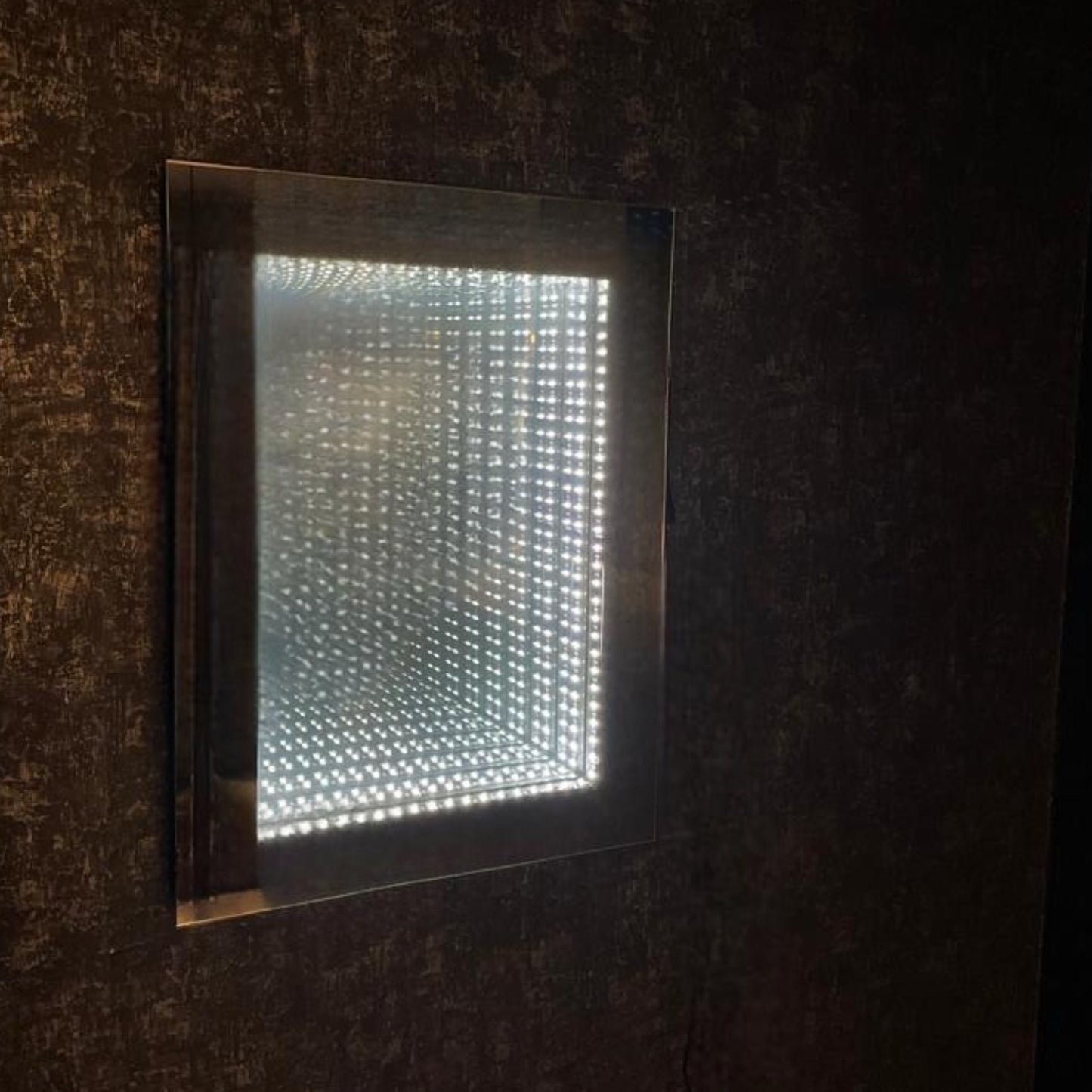 The Infinity mirror is IP44, meaning that it is fully splash proof and suitable for use in a bathroom setting.  The stylish rectangular mirror has LED lights so this is ideal for make up application or shaving.  LED's use up to 75% less energy and last up to 20 times longer than incandescent bulbs.
