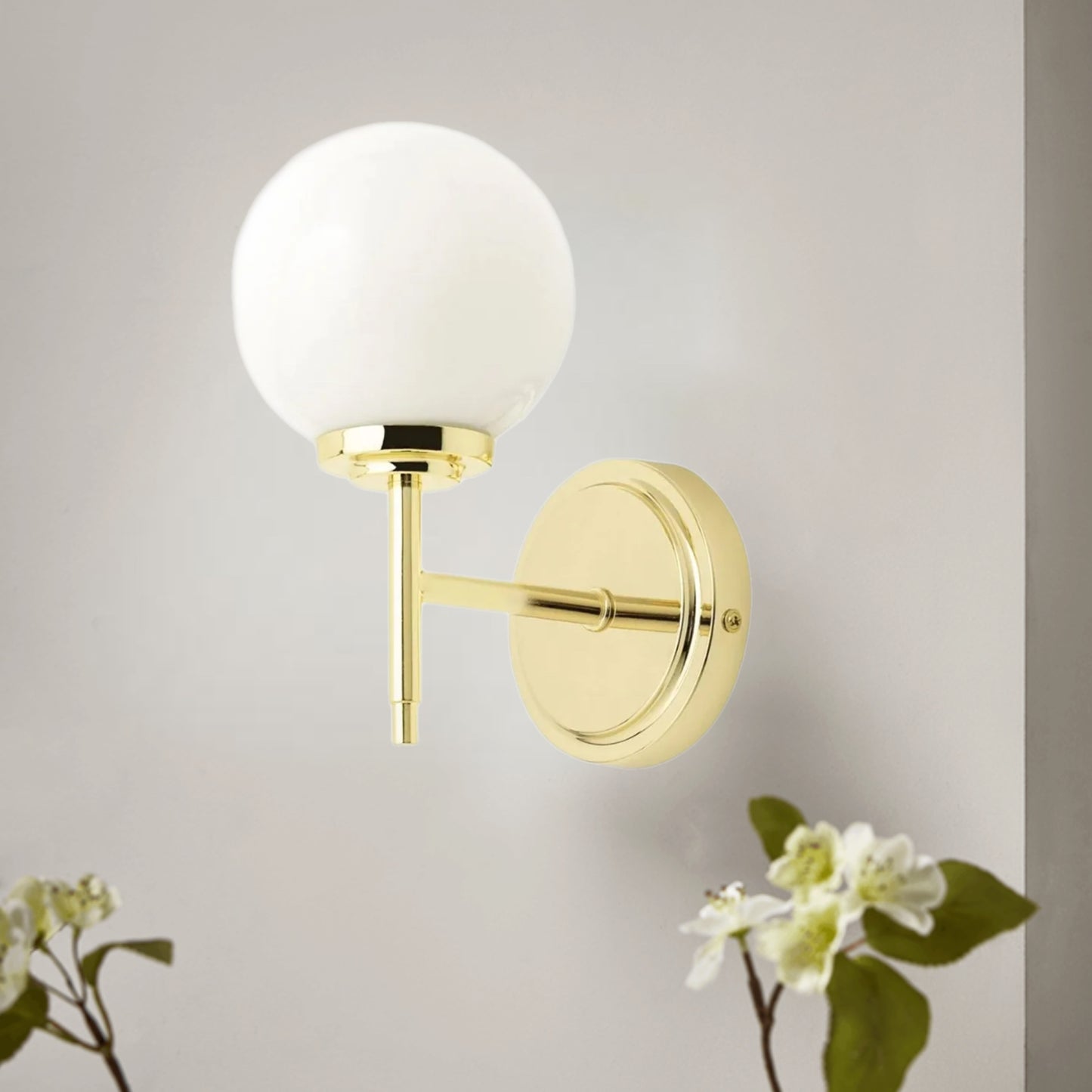 Our Marley globe armed wall light is a stylish light fitting ideal for the modern home and can be used in the bathroom. It features a brass effect round ceiling plate and a globe opal glass shade mounted on a brass arm.
