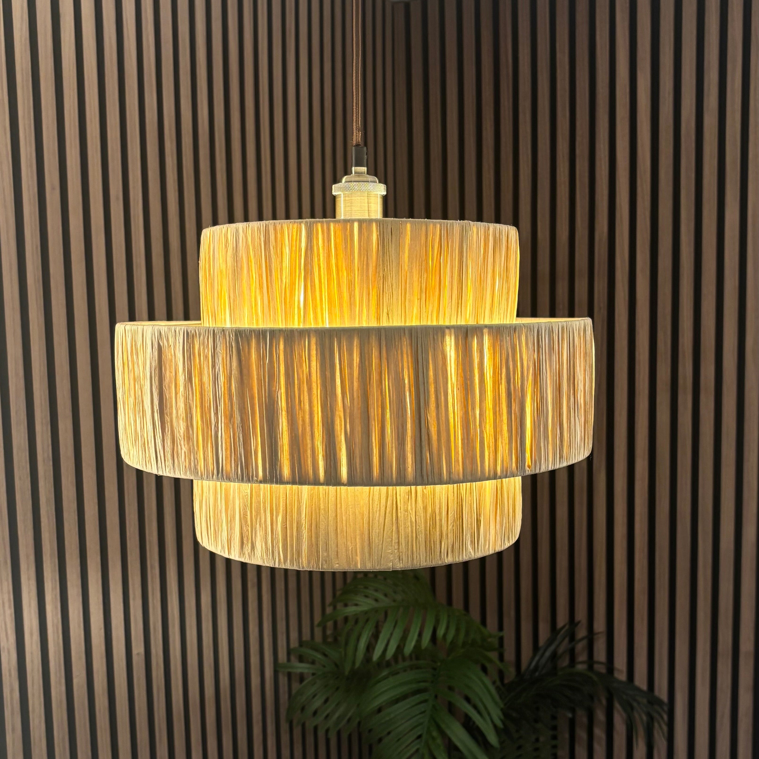 Decorative pendant light with a wooden texture against a striped wall.