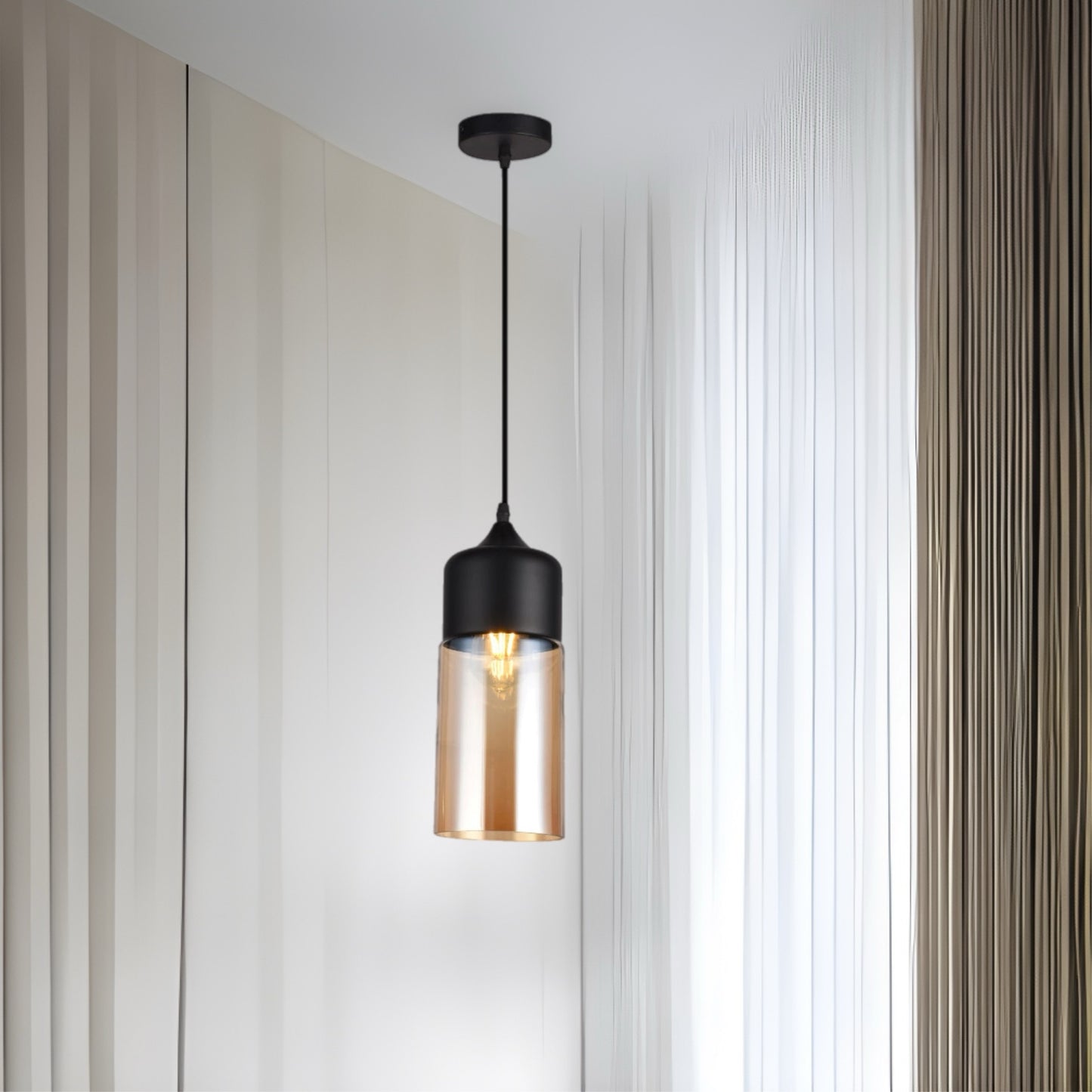 Our Lender pendant light is a stylish addition suitable for every room, its contrasting black and gold smoked glass cylinder body with matching black ceiling rose and cable creates an amazing feature on any ceiling. The lamp looks great with a filament light bulb, especially in industrial and modern interiors.