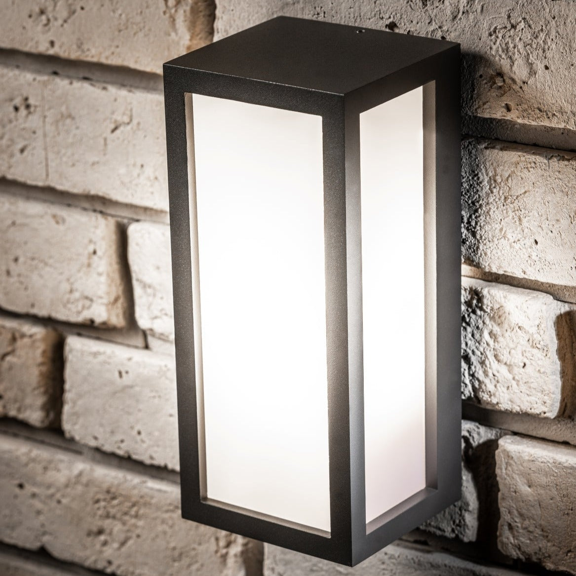 If you’re looking for a modern take on a traditional outdoor wall light, this black aluminium rectangle wall light is perfect for adding style and protection for your home. This classic design with a contemporary twist, styled with a metal rectangle shape and fitted with opal diffusers also contains an imposing black finish, making it ideal for any home design - adding a statement to any wall it fits in