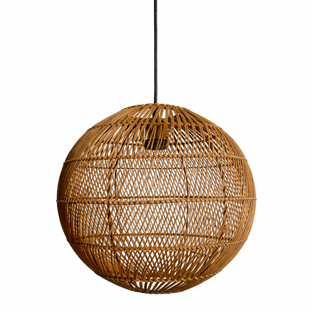 Woven rattan pendant light on a white background
