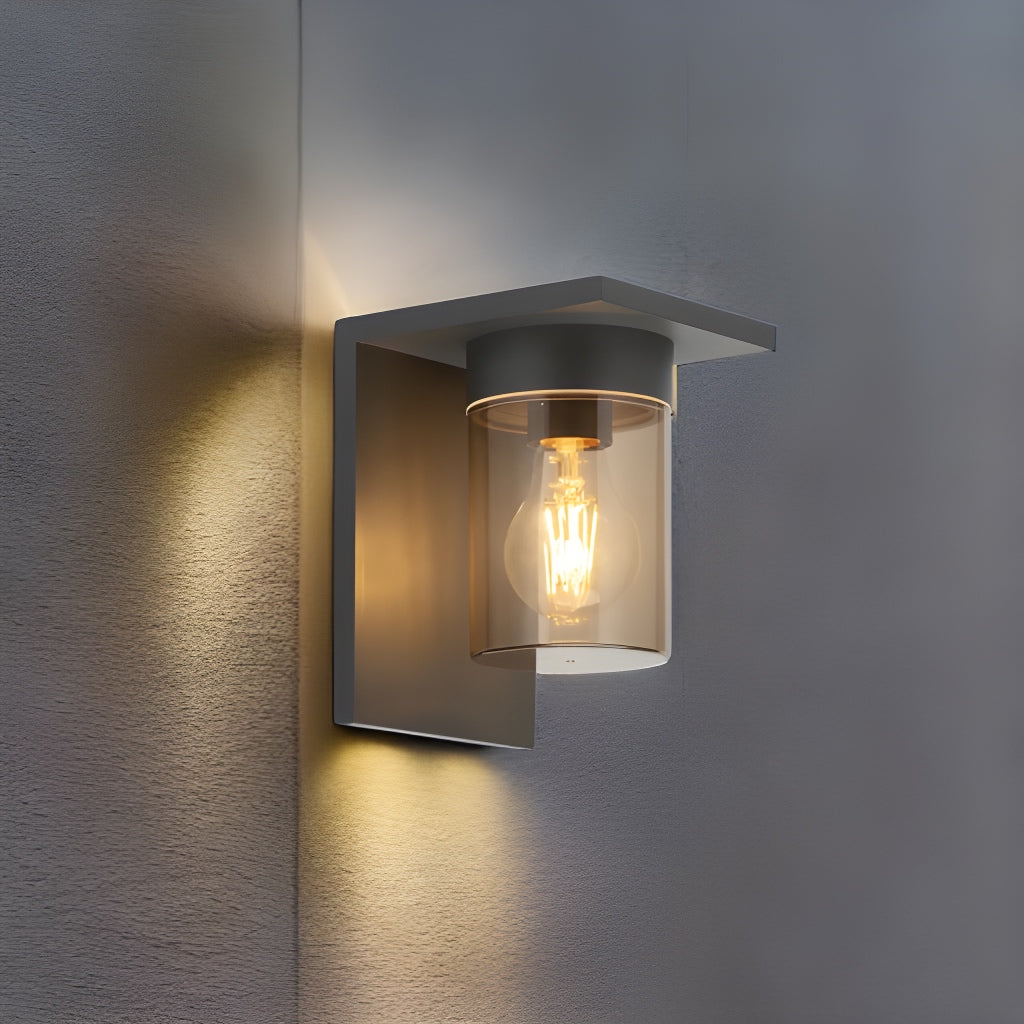 If you’re looking for a modern take on a traditional outdoor wall light, this anthracite wall light is perfect for adding style and protection for your home. This classic design with a contemporary twist, styled with a metal square shape and fitted with a smoked cylinder diffuser that allow the light to shine effectively. 