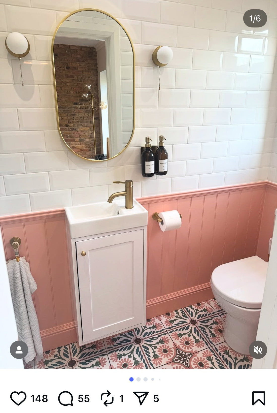 Bathroom interior with pink wainscoting, white sink, and toilet.