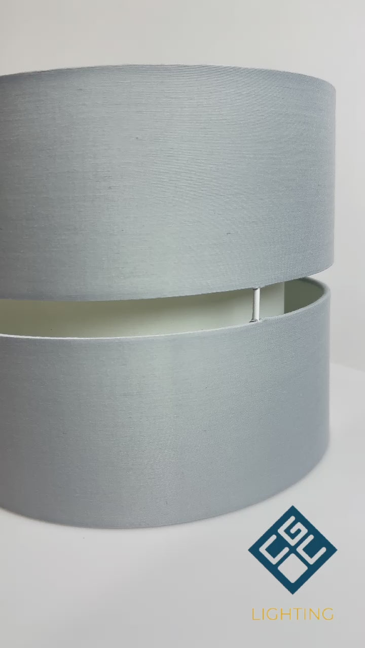 Our Gayle easy-fit two tiered luxury fabric double layered shade is contemporary in its appearance and we have designed the shade to suit a range of interiors. Easy to fit simply attached to an existing pendant flitting.  It is crafted from high quality fabric material in two layers and complimented with a white inner which looks beautiful when light shines through. The shade has been made to fit both a ceiling light or lamp base.