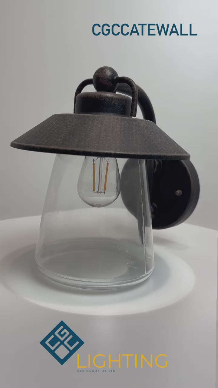 Load video: Black matt with washed bronze finish Applicable to walls Vintage styled light with metal framing and weathered looks. E27 bulb (not included), 60W max IP44 Rated for outdoor use, 220-240V mains power, ambient temperature -20 to +30, class 1 Height: 20 cm Width: 22.5 cm Shade Diameter: 17.6 cm
