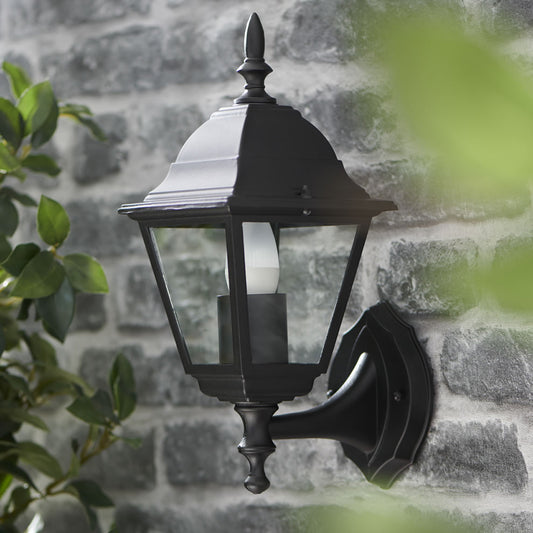 Our traditional front-door lantern in the form of our Erica Wall Light has the look of the traditional coach with the design to last. Made from durable rust proof aluminum and die cast body in matt black and constructed with fitted glass windows to show the bulb this is sure to add an statement to any wall 