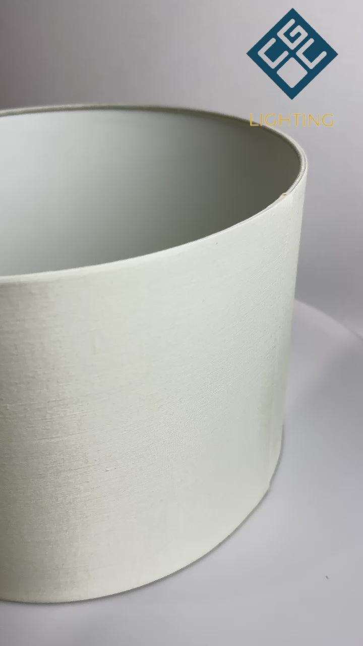 Load video: The Lucia is a modern cylinder drum shaped lamp shade in a luxury cotton finish and opal diffuser. This fantastic shade can double up as either a ceiling pendant light shade or table lampshade. Easily fits to your standard ceiling light socket - no wiring required.