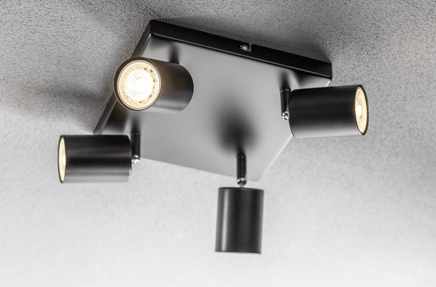 Light up your room with our Jack 4 light square spotlight plate, with 4 adjustable light heads allowing you to efficiently provide your space with personalised task lighting to resolve all your lighting needs. Finished in black, this retro inspired ceiling light adds a warm touch of colour to your room, creating the perfect accent lighting feature
