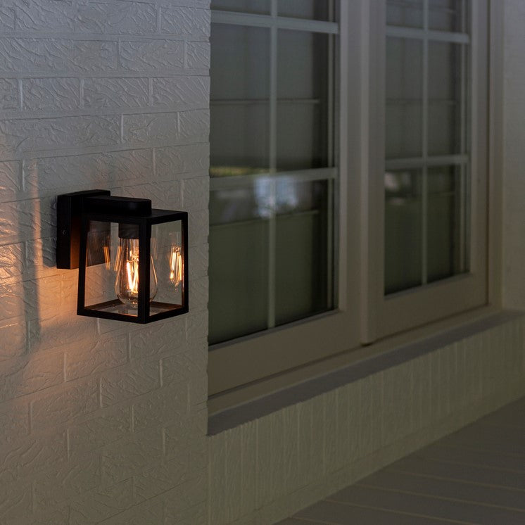 Our Zane wall lantern delivers on style and durability and is a smart choice for your exterior lighting. With its modern black matt heavy duty aluminum construction and glass panes, this wall light is hardwearing and weatherproof.  For sophisticated yet robust outdoor lighting  our Zane black outdoor modern lantern wall light is a strong contender.