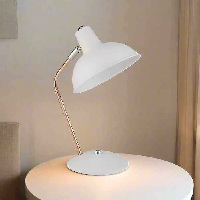 Our white and copper metal table lamp is sleek and modern in appearance. This fabulous lamp is a must have for homes wanting to inject a boost of colour. A beautifully modern design perfect for offices and brightening up darker corners of modern living or dining rooms.