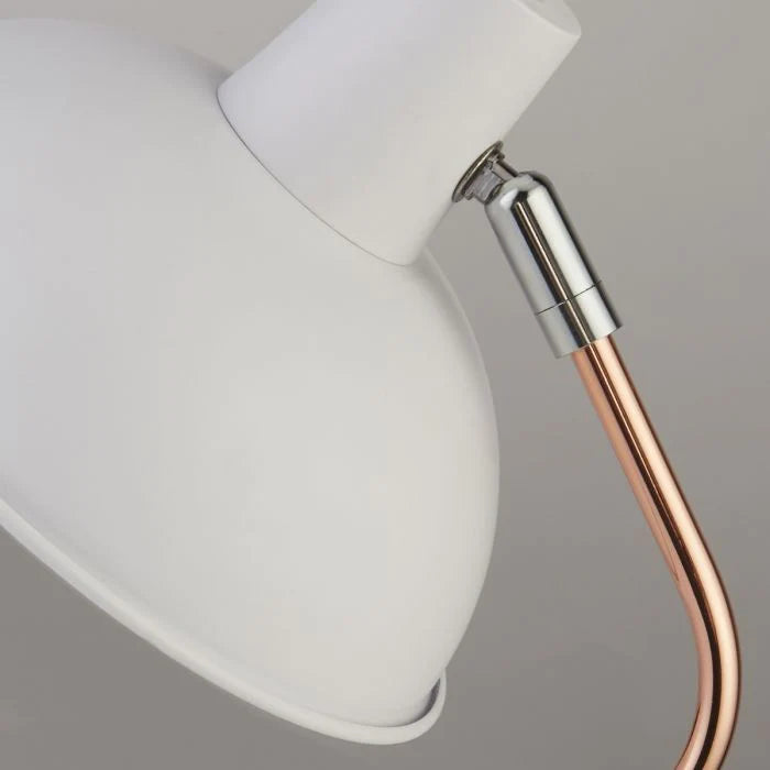 Our white and copper metal table lamp is sleek and modern in appearance. This fabulous lamp is a must have for homes wanting to inject a boost of colour. A beautifully modern design perfect for offices and brightening up darker corners of modern living or dining rooms.