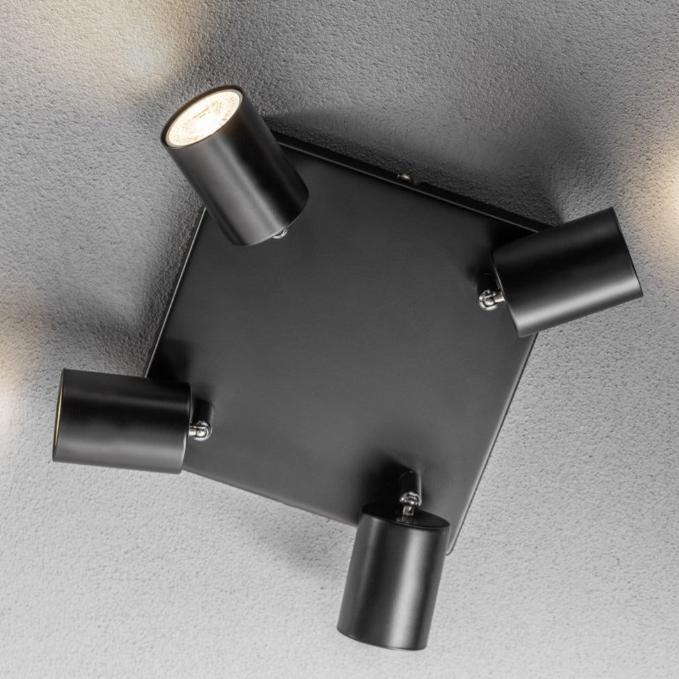 Light up your room with our Jack 4 light square spotlight plate, with 4 adjustable light heads allowing you to efficiently provide your space with personalised task lighting to resolve all your lighting needs. Finished in black, this retro inspired ceiling light adds a warm touch of colour to your room, creating the perfect accent lighting feature