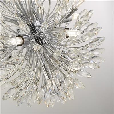 No matter where is hung, the Peacock chandelier will create a stunning centrepiece. As a focal point in any room, it's a mix of chrome, metal and beautifully cut crystal glass drops. The 14 lights of this chandelier will send light cascading out around any room creating stunning patterns and adding an air of old school elegance.