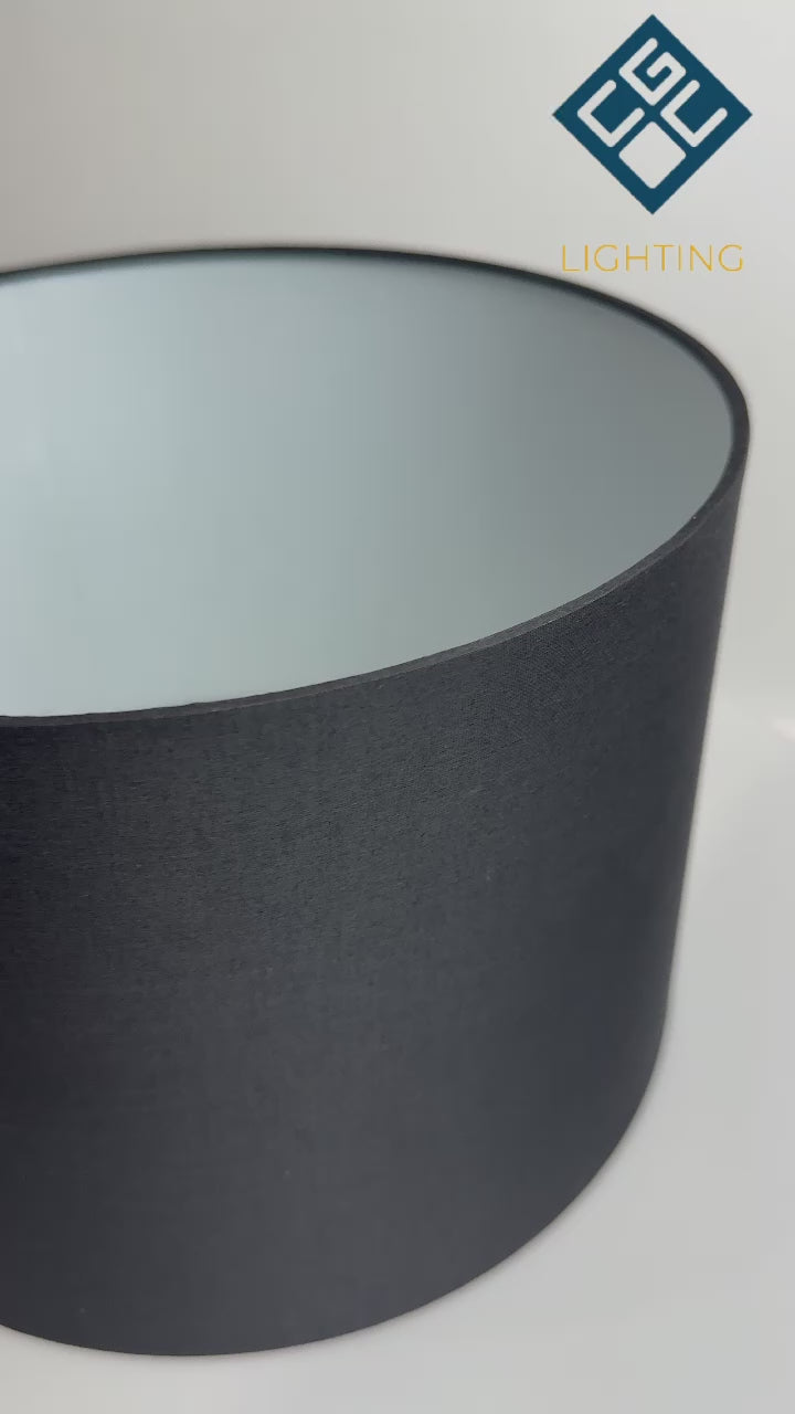 Load video: The Lucia is a modern cylinder drum shaped lamp shade in a luxury cotton finish and opal diffuser. This fantastic shade can double up as either a ceiling pendant light shade or table lampshade. Easily fits to your standard ceiling light socket - no wiring required.