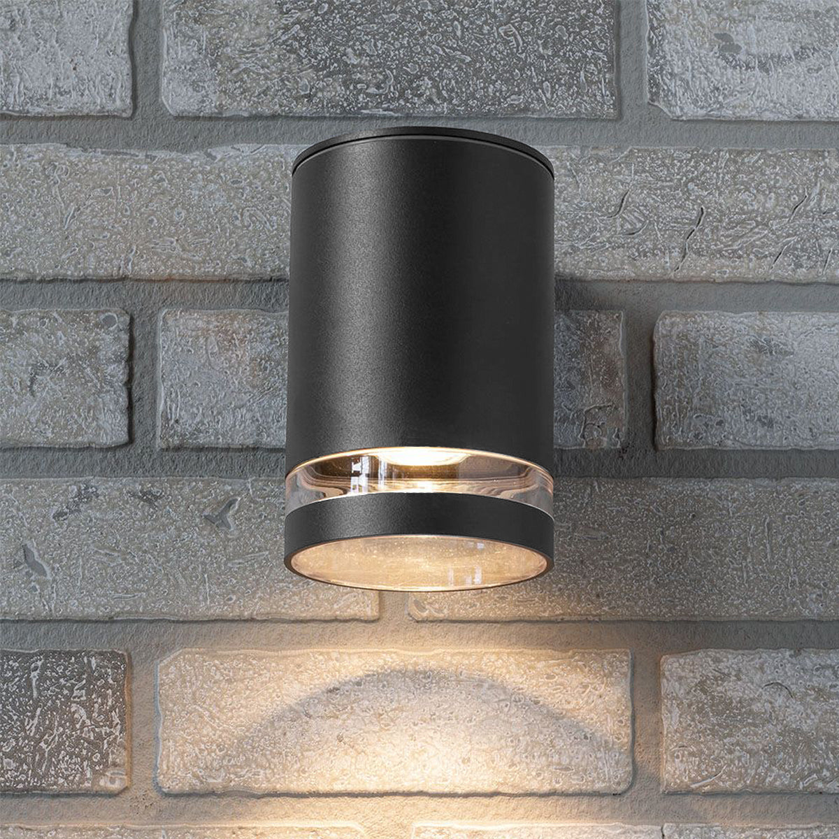 Our Jennifer dark grey outdoor wall mounted cylinder single spot outdoor light would look perfect in a modern or more traditional home design. Outside wall lights can provide atmospheric light in your garden, at the front door or on the terrace as well as a great security solution. It is designed for durability and longevity with its robust material producing a fully weatherproof and water resistant light fitting.