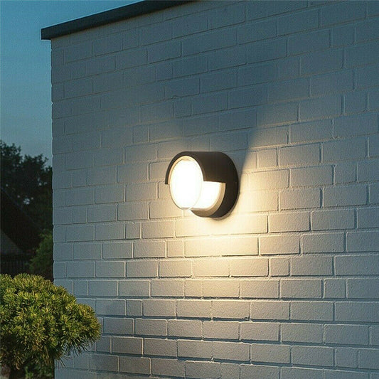 Sophia black and white round wall light is an modern simple fitting with a black polycarbonate body and opal diffuser. This stylish wall light is perfect for adding a pinch of modern flavour to doorways, sheds, patios, porch, driveways, garages, sheds, and more. This fitting is IP65 rated which makes it fully weatherproof light fitting.