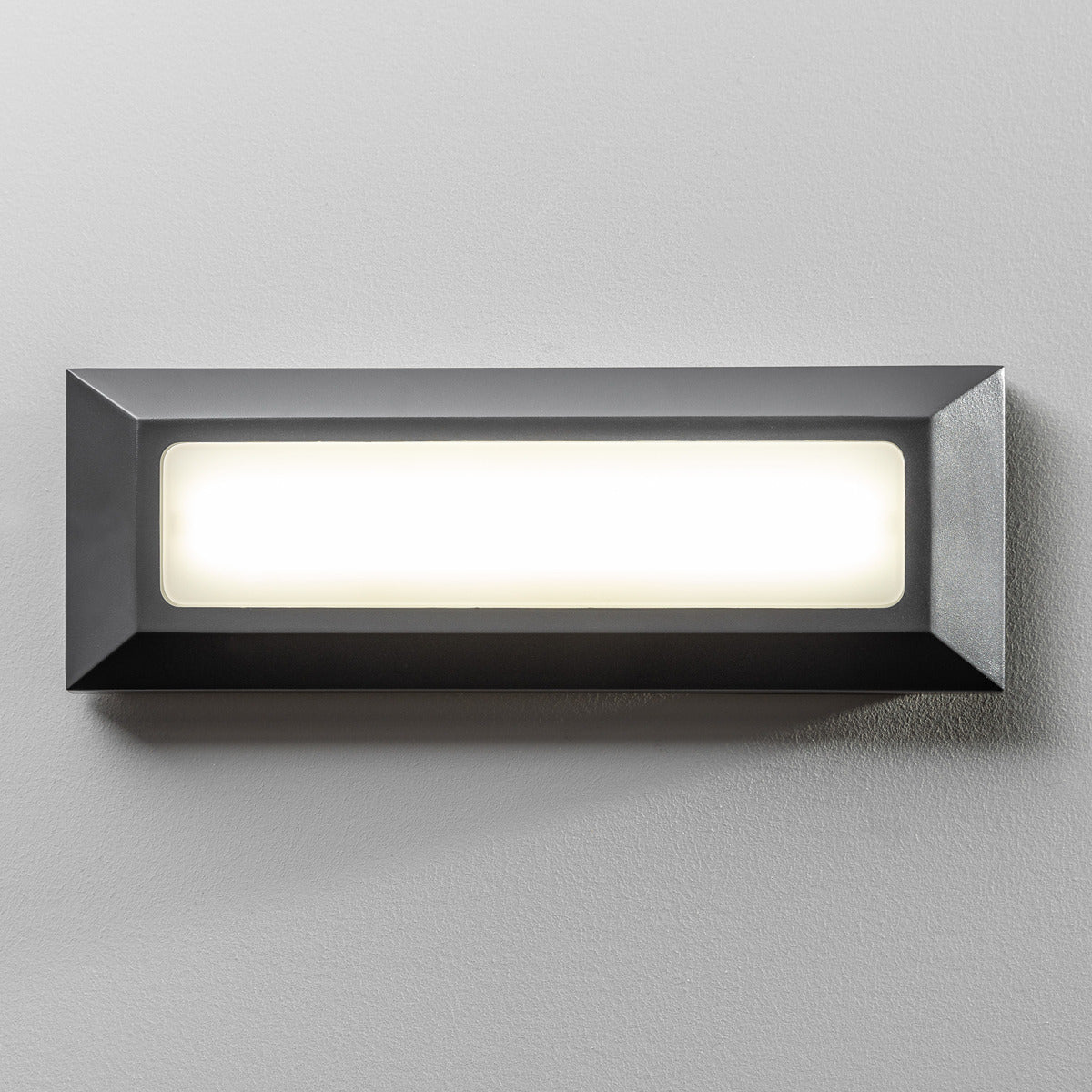 Our Rebecca dark grey LED outdoor brick light would look perfect in a modern or more traditional home design. Outside brick lights can provide atmospheric light in your garden, at the front door or on the terrace as well as a great security solution. It is designed for durability and longevity with its robust material producing a fully weatherproof and water-resistant light fitting. Save money on your lighting, this brick light runs on low energy consumption LED which means its low cost to run.