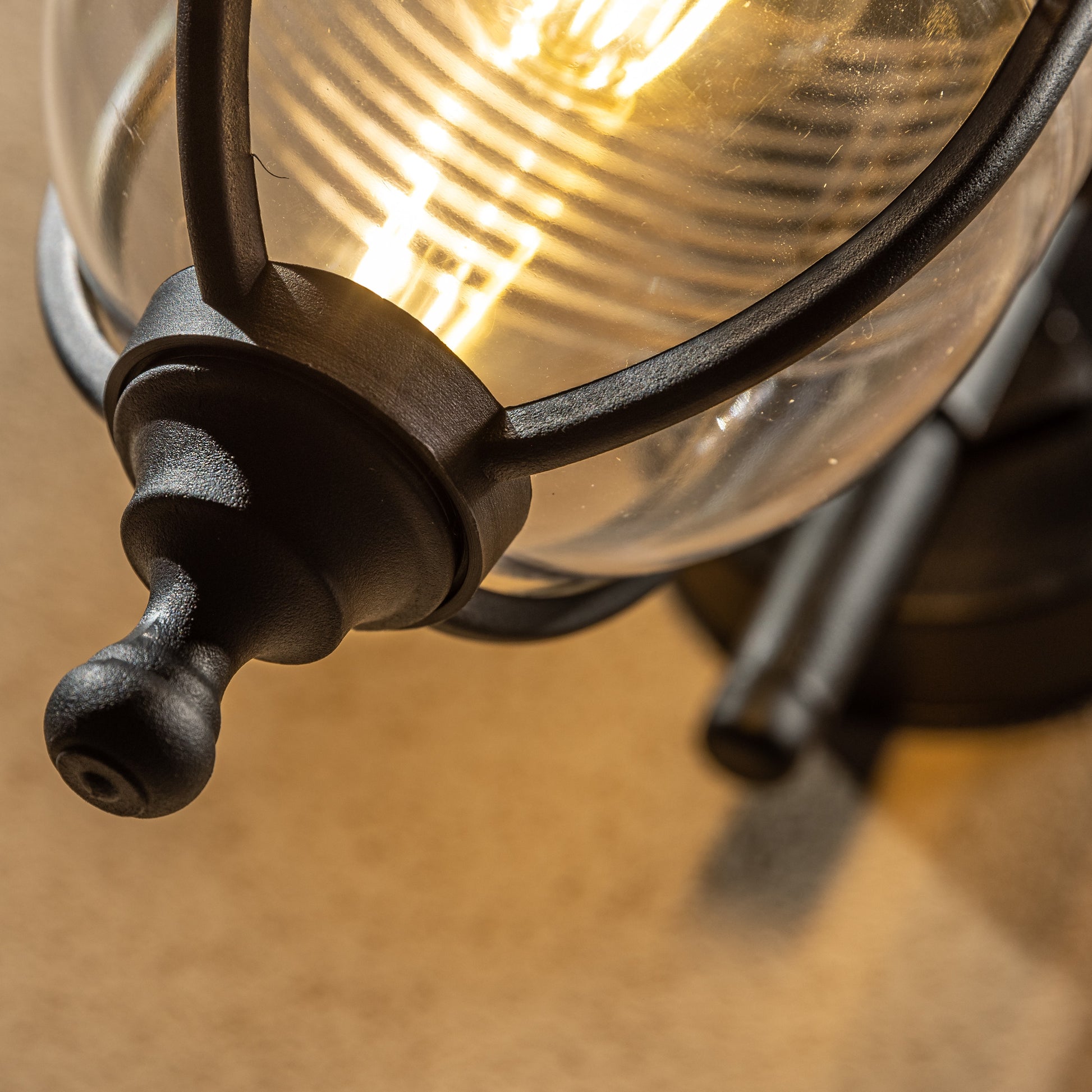 The Jemima black fisherman hooked outdoor wall lantern light is constructed of polycarbonate and features an attractive design inspired by traditional lighting styles. This lantern wall light is a great choice for illuminating doorways and porches, creating a warm and inviting look and a safe environment. With an IP44 safety rating, the Jemima garden wall light is suitable for mounting on outdoor walls.