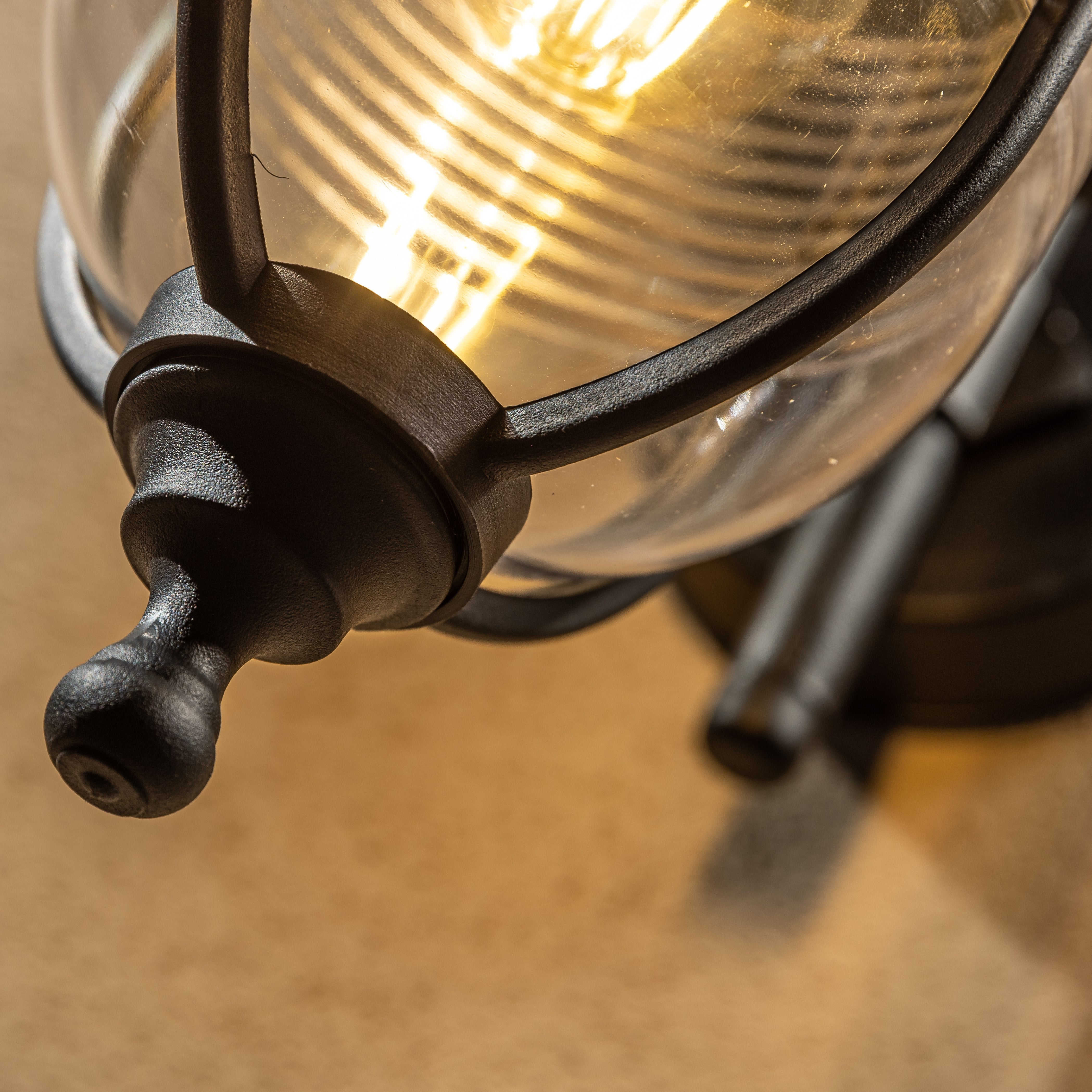 The Jemima black fisherman hooked outdoor wall lantern light is constructed of polycarbonate and features an attractive design inspired by traditional lighting styles. This lantern wall light is a great choice for illuminating doorways and porches, creating a warm and inviting look and a safe environment. With an IP44 safety rating, the Jemima garden wall light is suitable for mounting on outdoor walls.